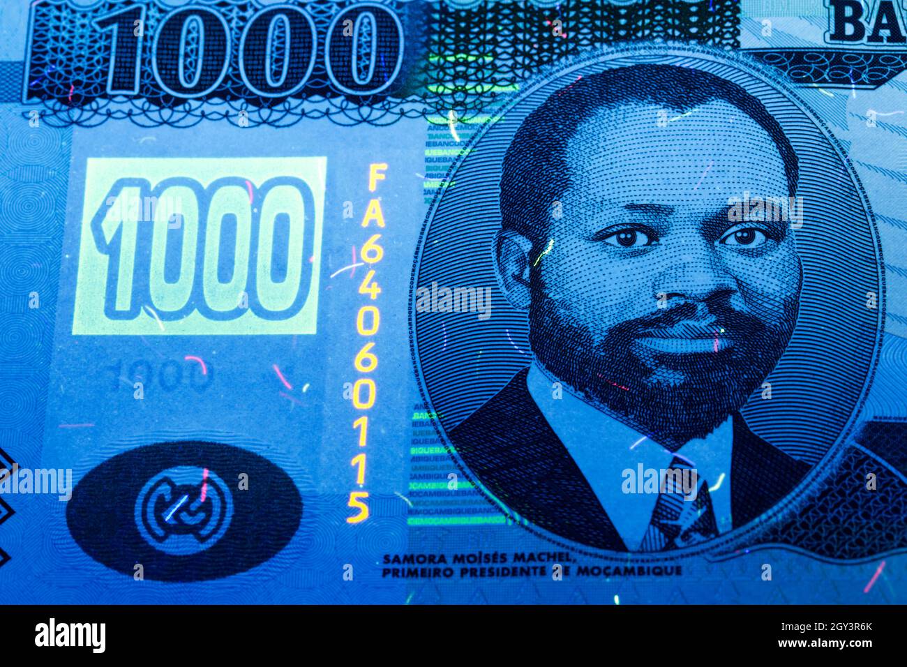 Mozambican money - metical in UV rays Stock Photo