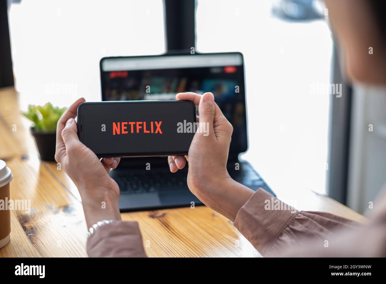 CHIANG MAI, THAILAND OCT 01, 2021 : Netflix logo on iPhone XS screen. Netflix is an international leading subscription service for watching TV Stock Photo