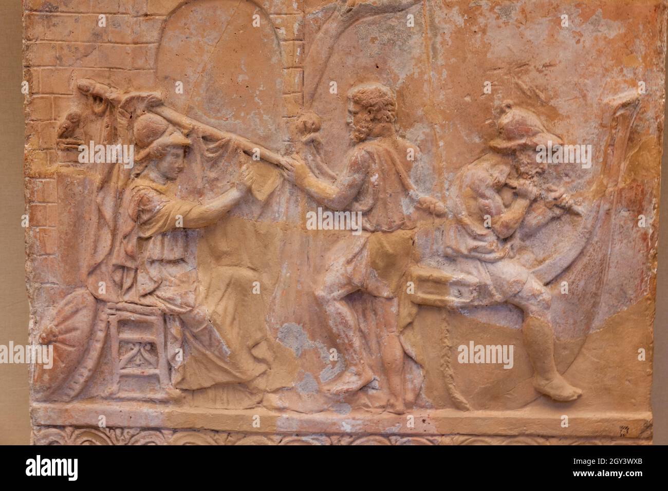 terracotta relief of Athena and Jason getting a ship ready. Historical roman art work first century Stock Photo