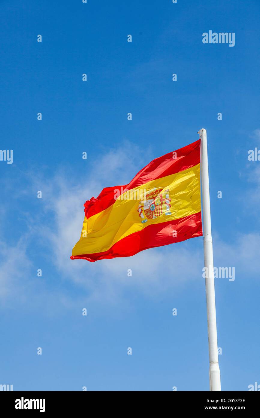 The flag of Spain, as it is defined in the Spanish Constitution of 1978, consists of three horizontal stripes: red, yellow and red, the yellow stripe Stock Photo