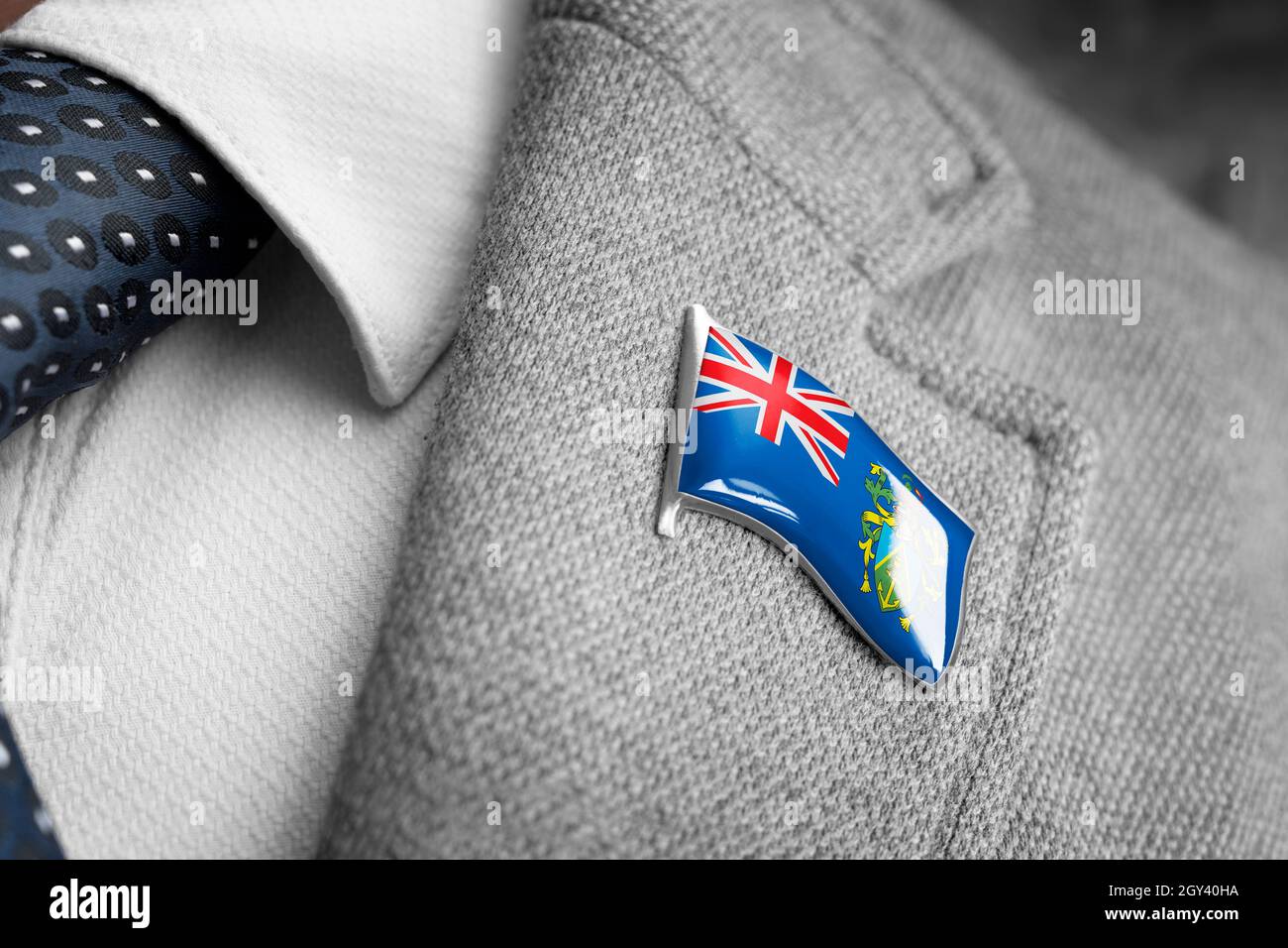 Metal badge with the flag of Pitcairn Islands on a suit lapel Stock Photo