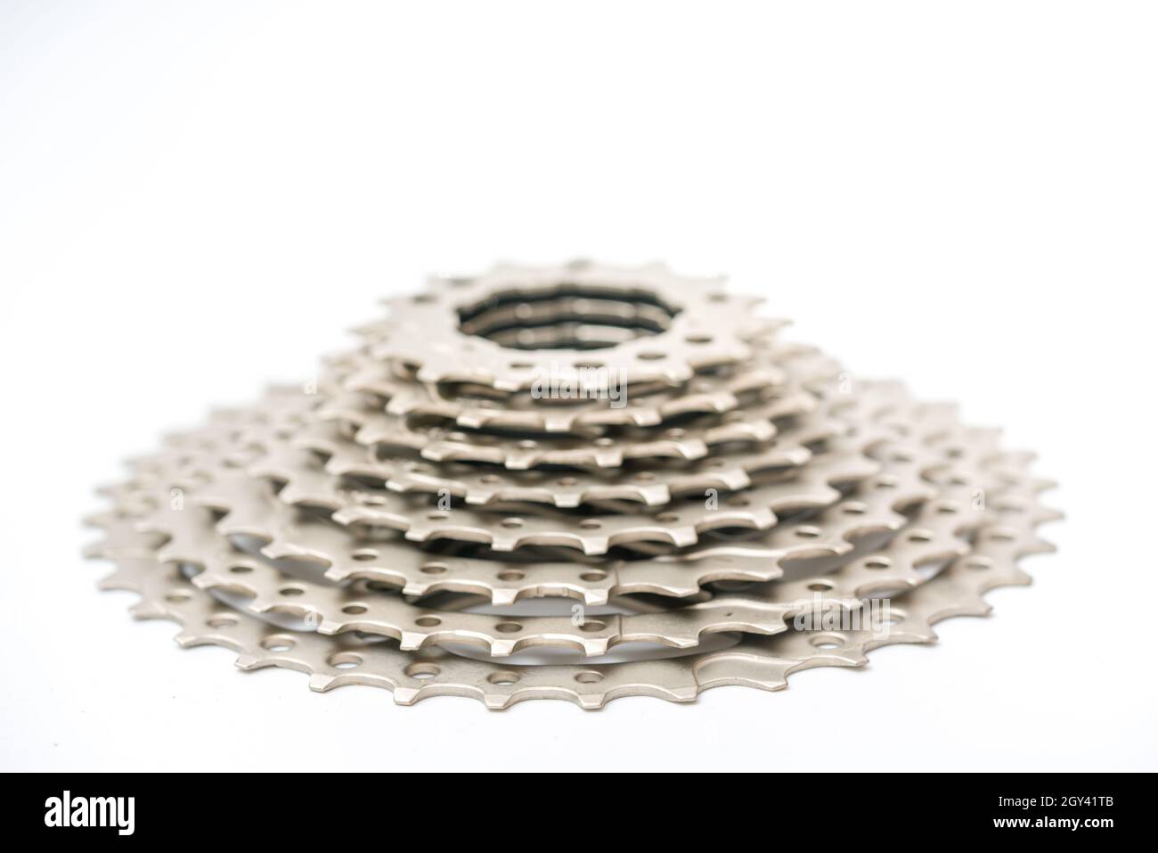 Gears, sprockets and chain of a mountain sports bike on a white