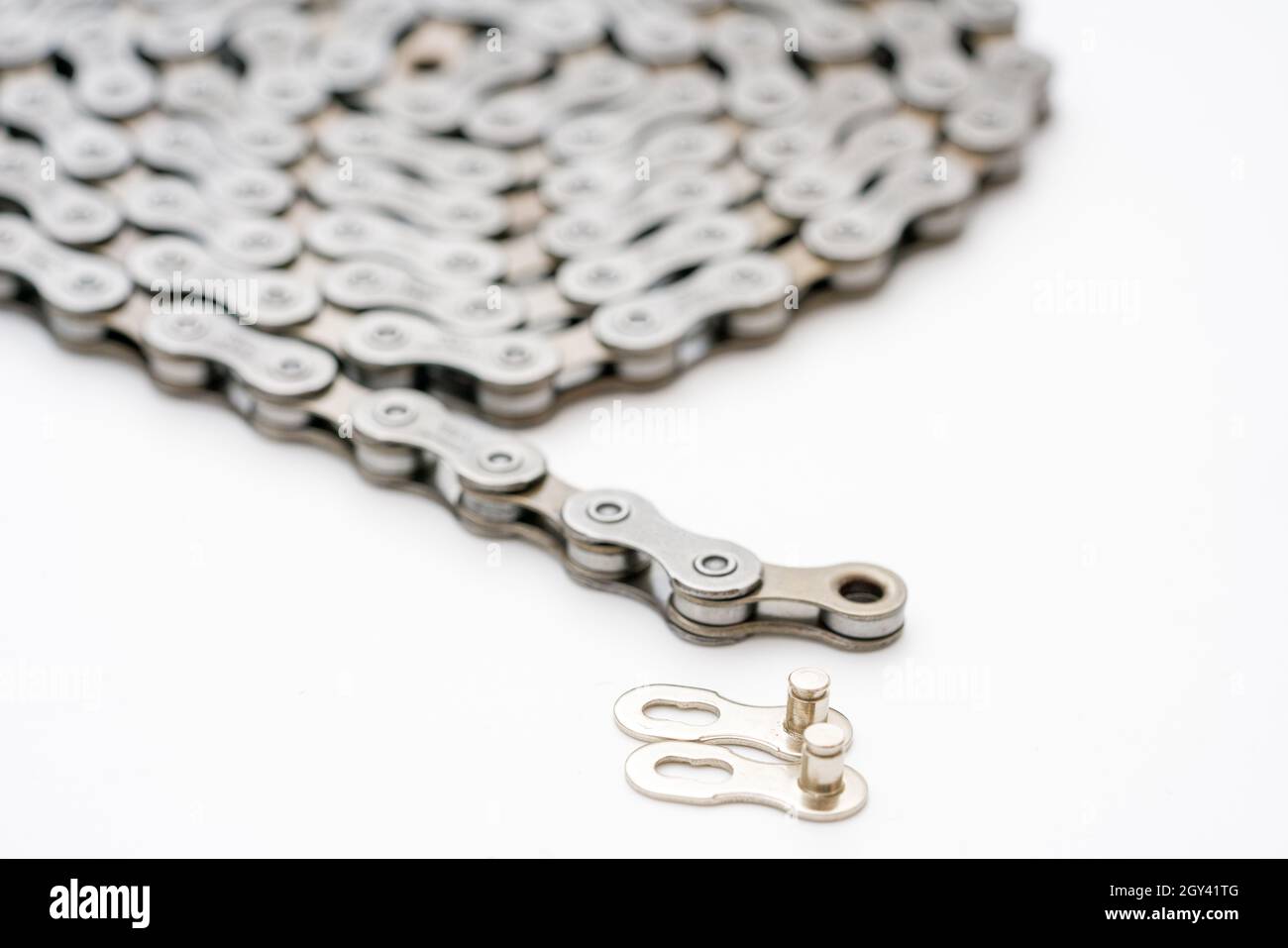 Gears, sprockets and chain of a mountain sports bike on a white background. Bicycle parts Stock