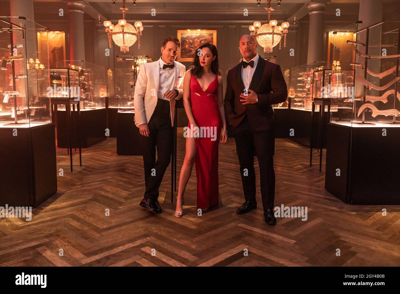 (LR) Ryan Reynolds is the world’s greatest art thief Nolan Booth; Gal