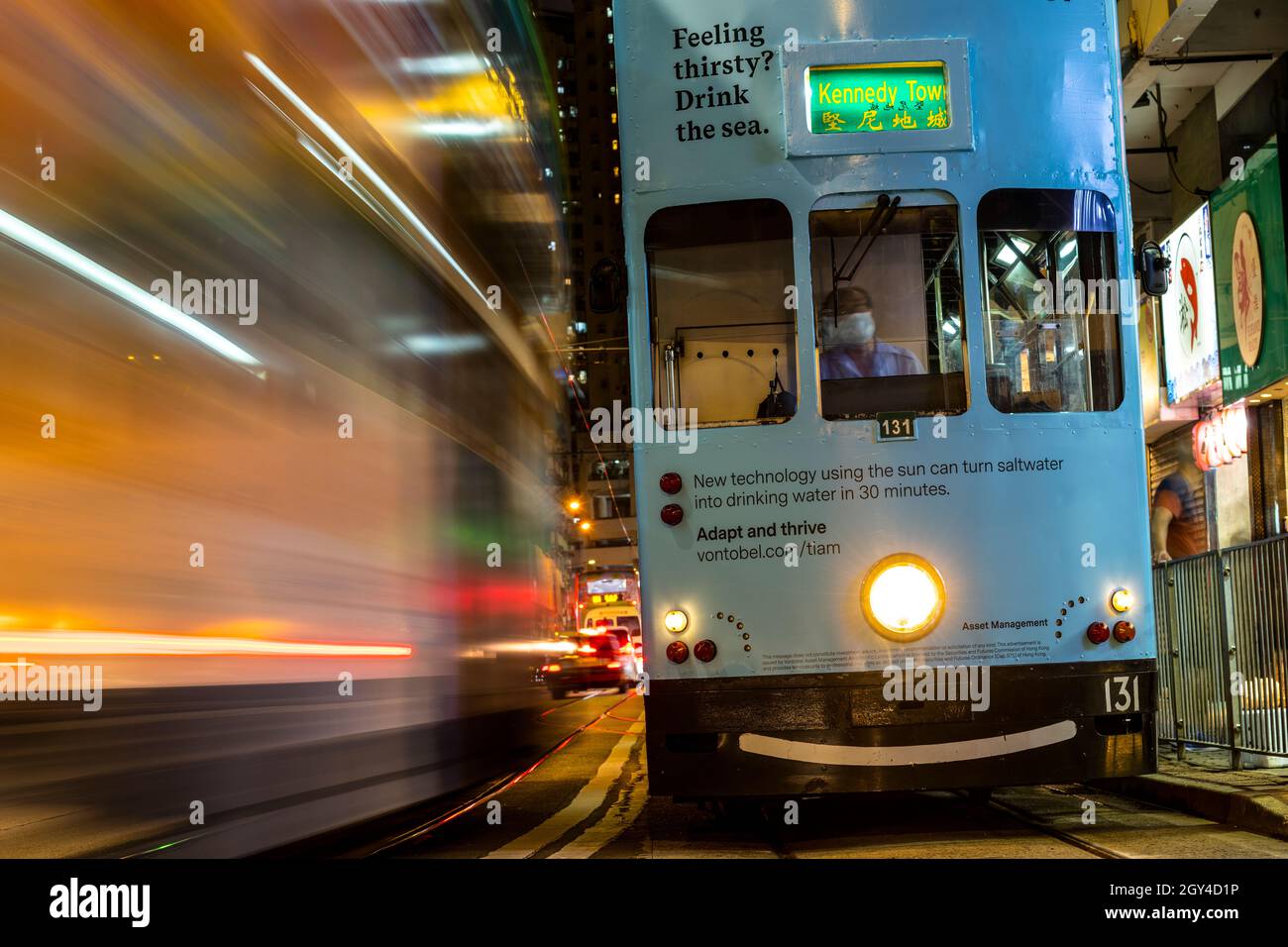 A Hong Kong tram advertising the development of a new light responsive technology that can convert seawater into drinking water within 30 minutes. Stock Photo