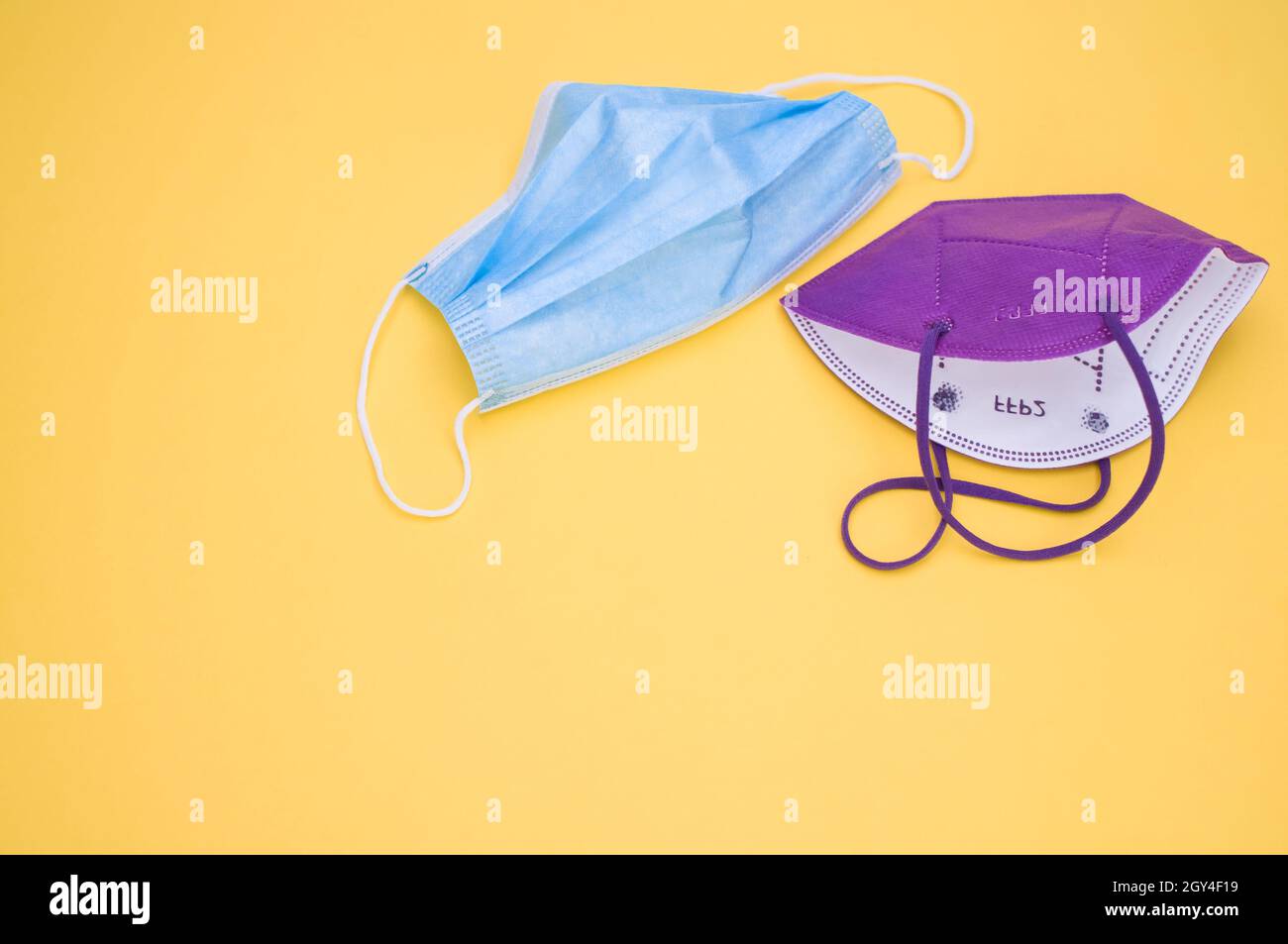 Isolated respiratory mask and syringe on a yellow background Stock ...