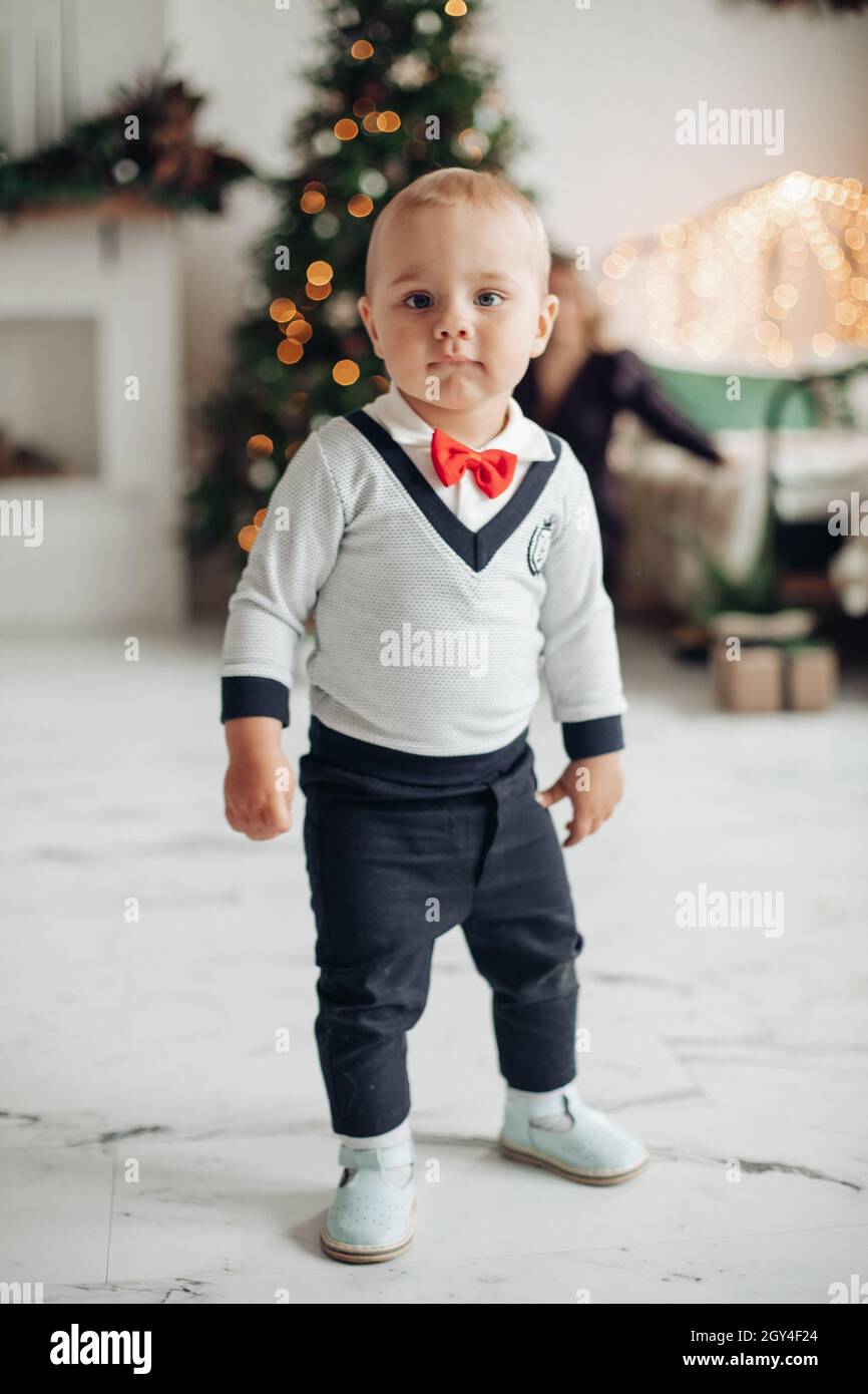 Stylish baby boy looking at camera Stock Photo - Alamy