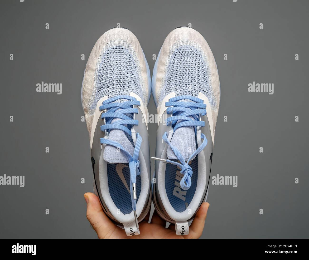 Pov male hand holding showing new luxury running shoes Nike Zoom react  Stock Photo - Alamy