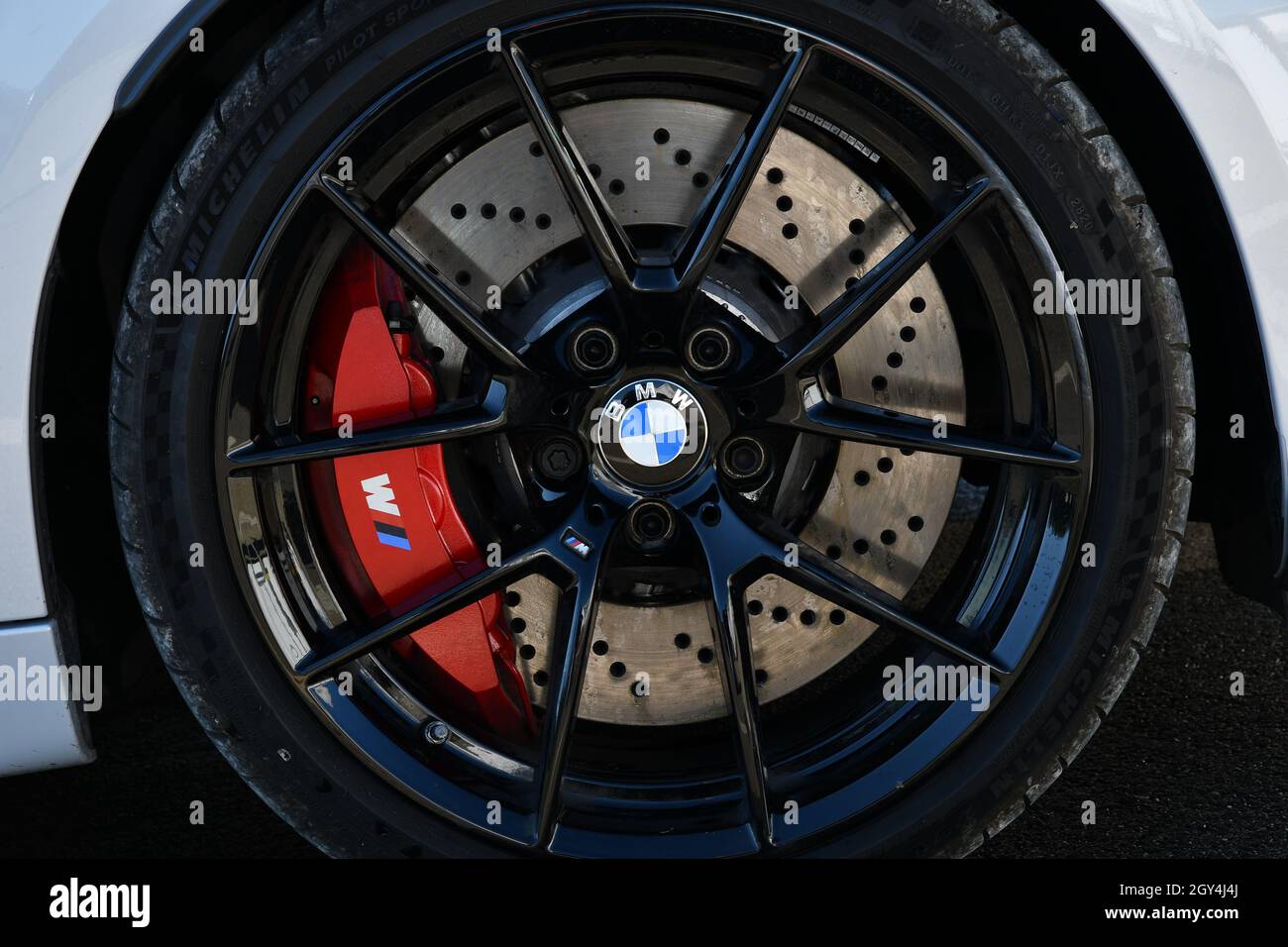 Mugello Circuit, Italy - 23 September 2021: detail of an alloy wheel rim with brake caliper of a BMW Sports car in the paddock of Mugello Circuit. Ita Stock Photo