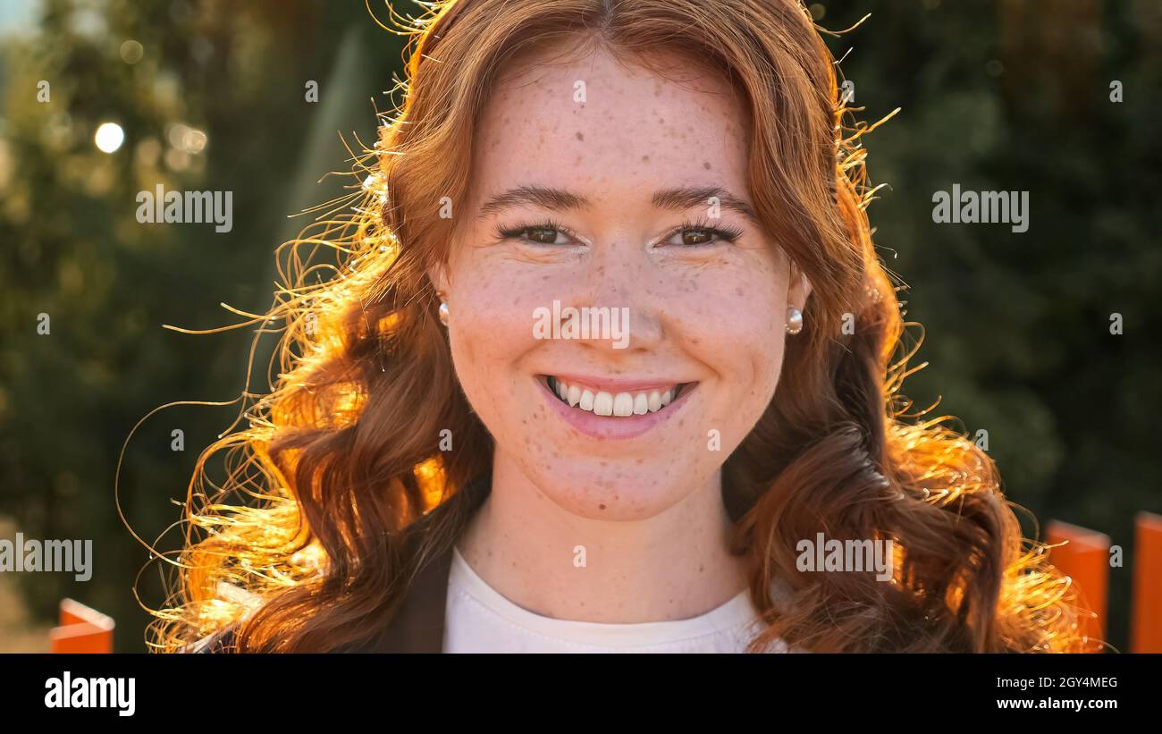 Woman curly red hair smiles hi-res stock photography and images - Alamy