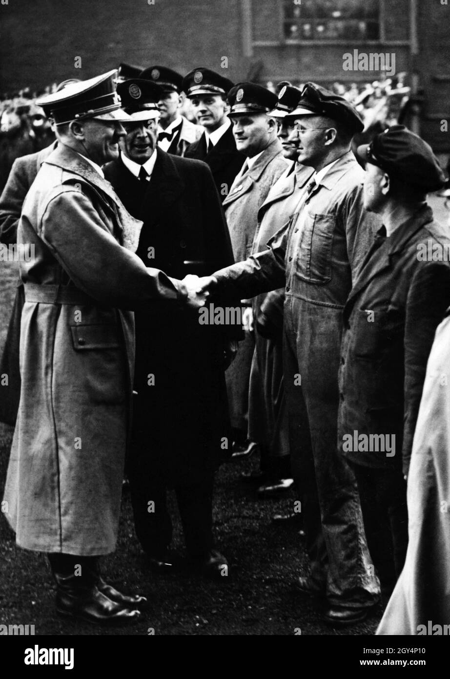 'Christened ''Robert Ley'' by the German labour leader, the second holiday ship of the NS leisure organisation KDF (Kraft durch Freude) was launched on 29.03.1938 in the presence of Adolf Hitler. In the picture Hitler congratulates workers involved in the construction of the ship. [automated translation]' Stock Photo