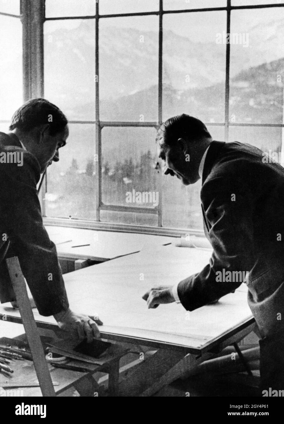 Albert Speer during a visit to Hitler's mountain farm on the Obersalzberg, where he is presented with new building plans. [automated translation] Stock Photo