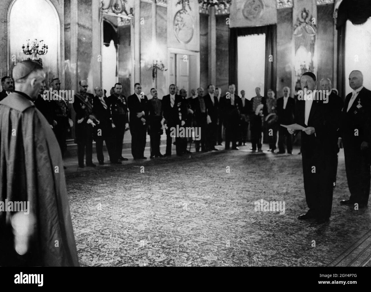 Adolf Hitler addressing the diplomatic corps in the large audience hall in the Reich President's Palace. Hitler invited diplomats to the palace after the unification of the offices of Reich Chancellor and Reich President on his peson. [automated translation] Stock Photo