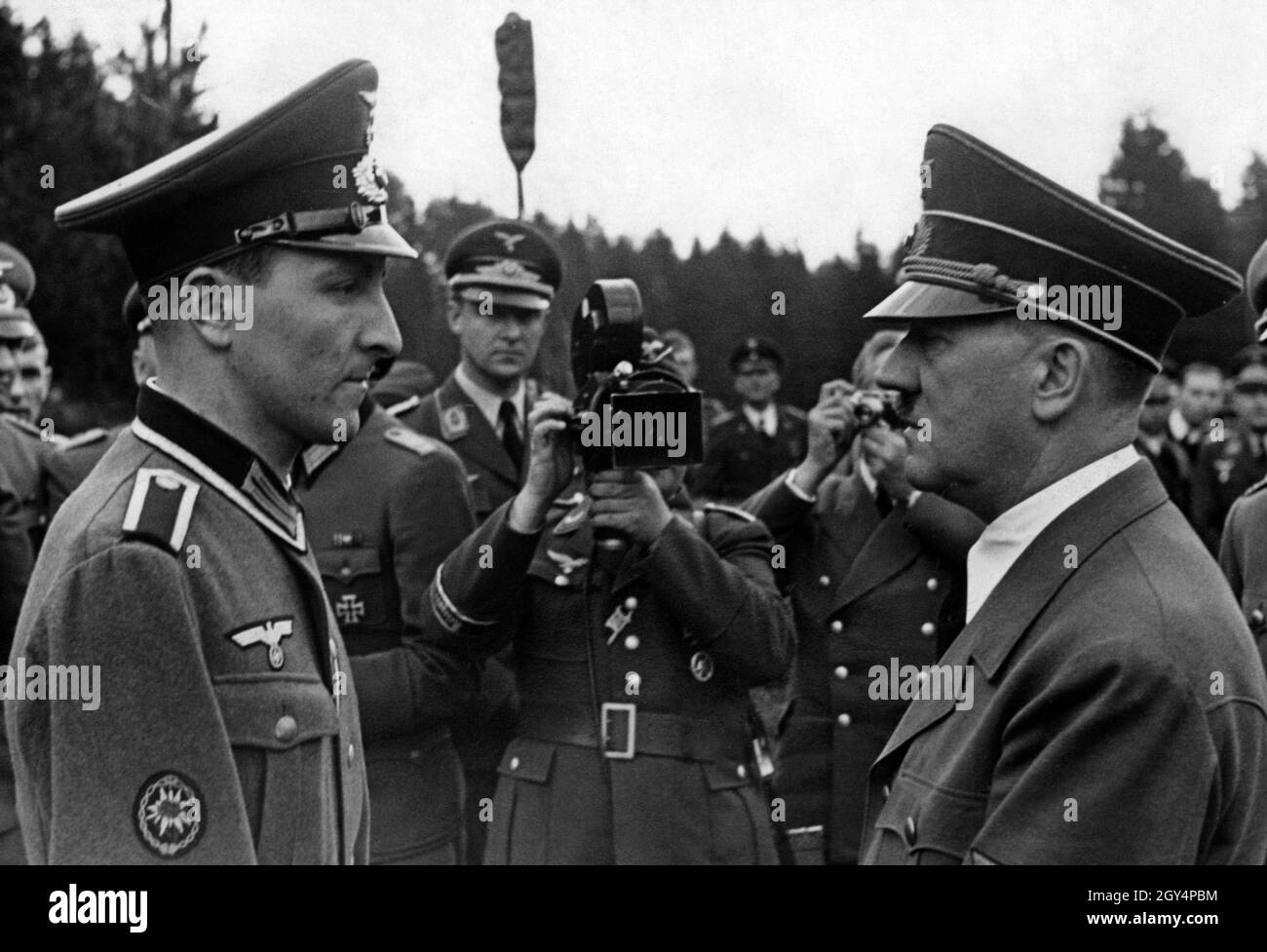 Adolf Hitler is in conversation with a non-commissioned officer of the ...