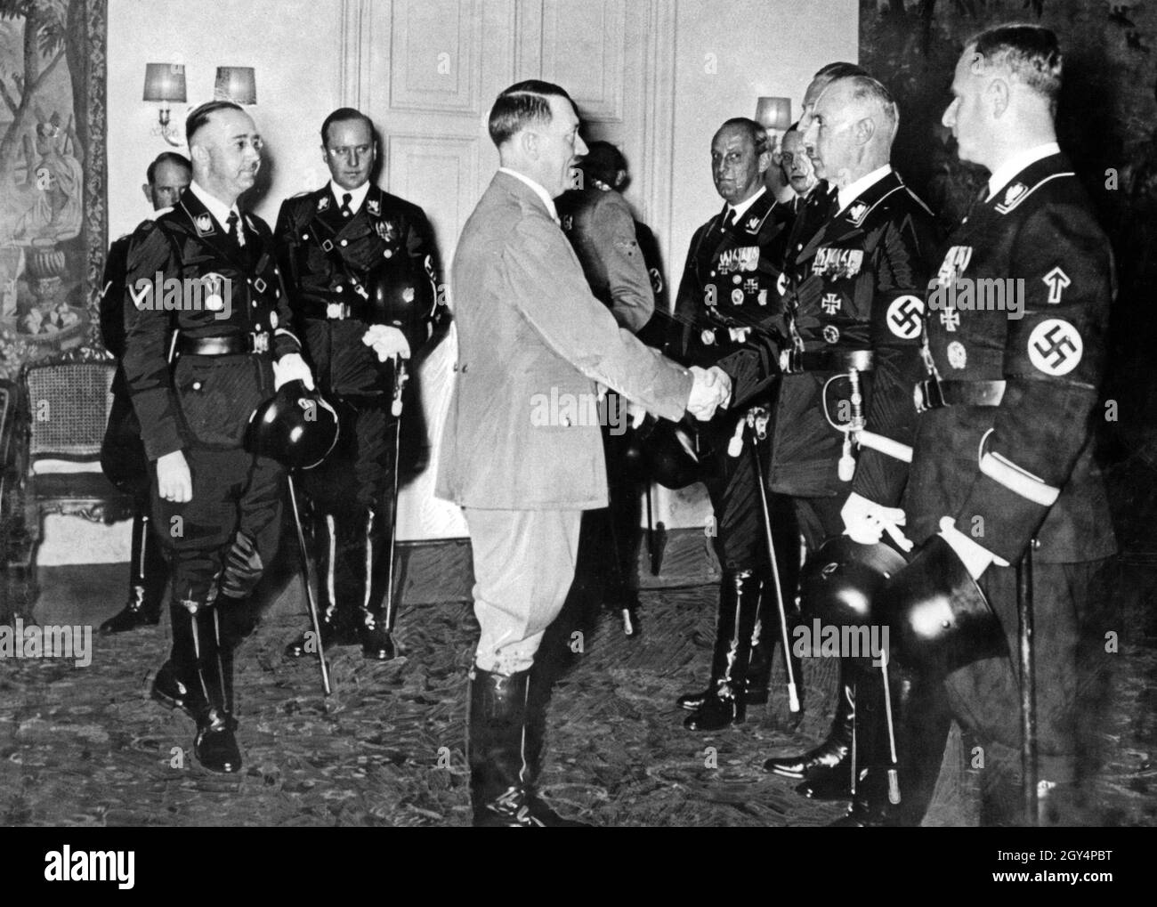 Heinrich Himmler and SS officers in the Gruppenführer rank of the SS Fuehrer Corps congratulate Adolf Hitler on his birthday. [automated translation] Stock Photo