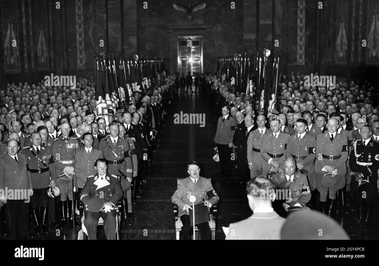Hermann Göring, Adolf Hitler and Robert Ley listen to a speech by Rudolf Hess on the occasion of Hitler's 50th birthday. The photo was taken on April 30, 1939. Standing in the back (from left): Minister Walther Funk, Reich Leader NSKK Adolf Hühnlein, Reich Youth Leader Baldur von Schirach, Colonel General Fedor von Bock, Propaganda Minister Joseph Goebbels, Chief of Staff SA Viktor Lutze. [automated translation] Stock Photo
