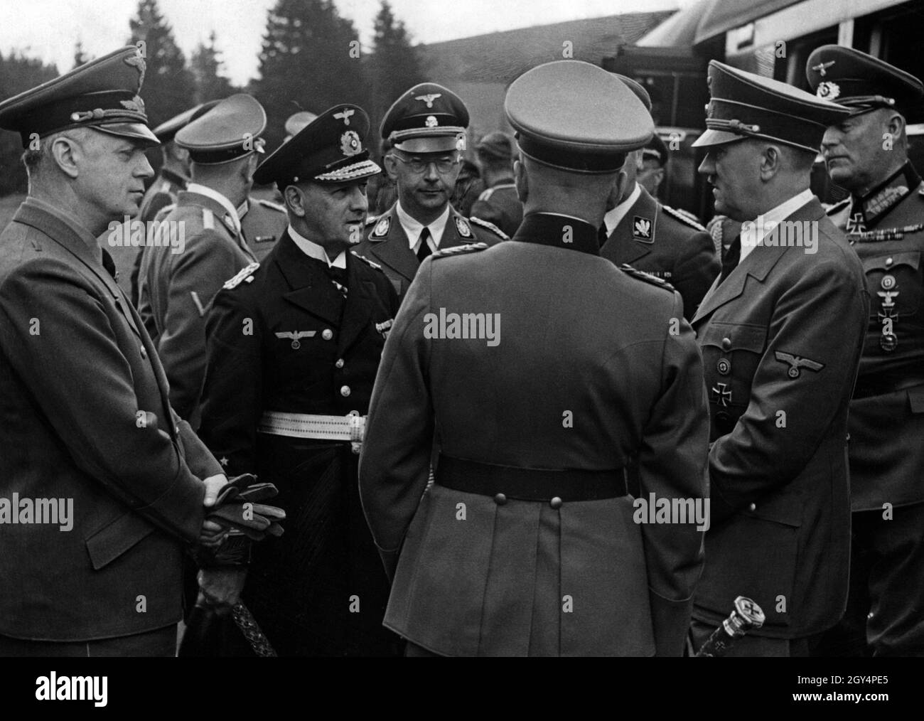 Adolf Hitler is surrounded by commanders and military officers at the Führer's headquarters. Around him, from left, are Joachim von Ribbentrop, Erich Raeder, Heinrich Himmler, Wilhelm Keitel and, facing away, Walther von Brauchitsch with his field marshal's baton on his right. [automated translation] Stock Photo
