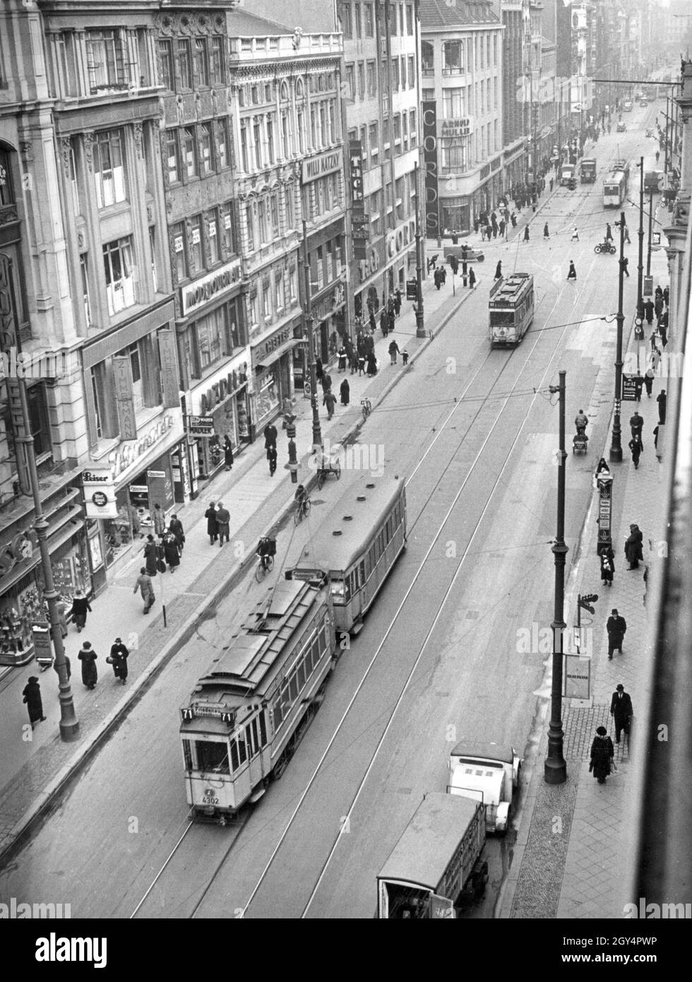 Trams (including line 71 to Friedenau) travel on Leipziger Strasse in Berlin -Mitte on January 25, 1938. The view is from Friedrichstrasse in the  direction of Charlottenstrasse and Dönhoffplatz (today:  Marion-Gräfin-Dönhoff-Platz). The street