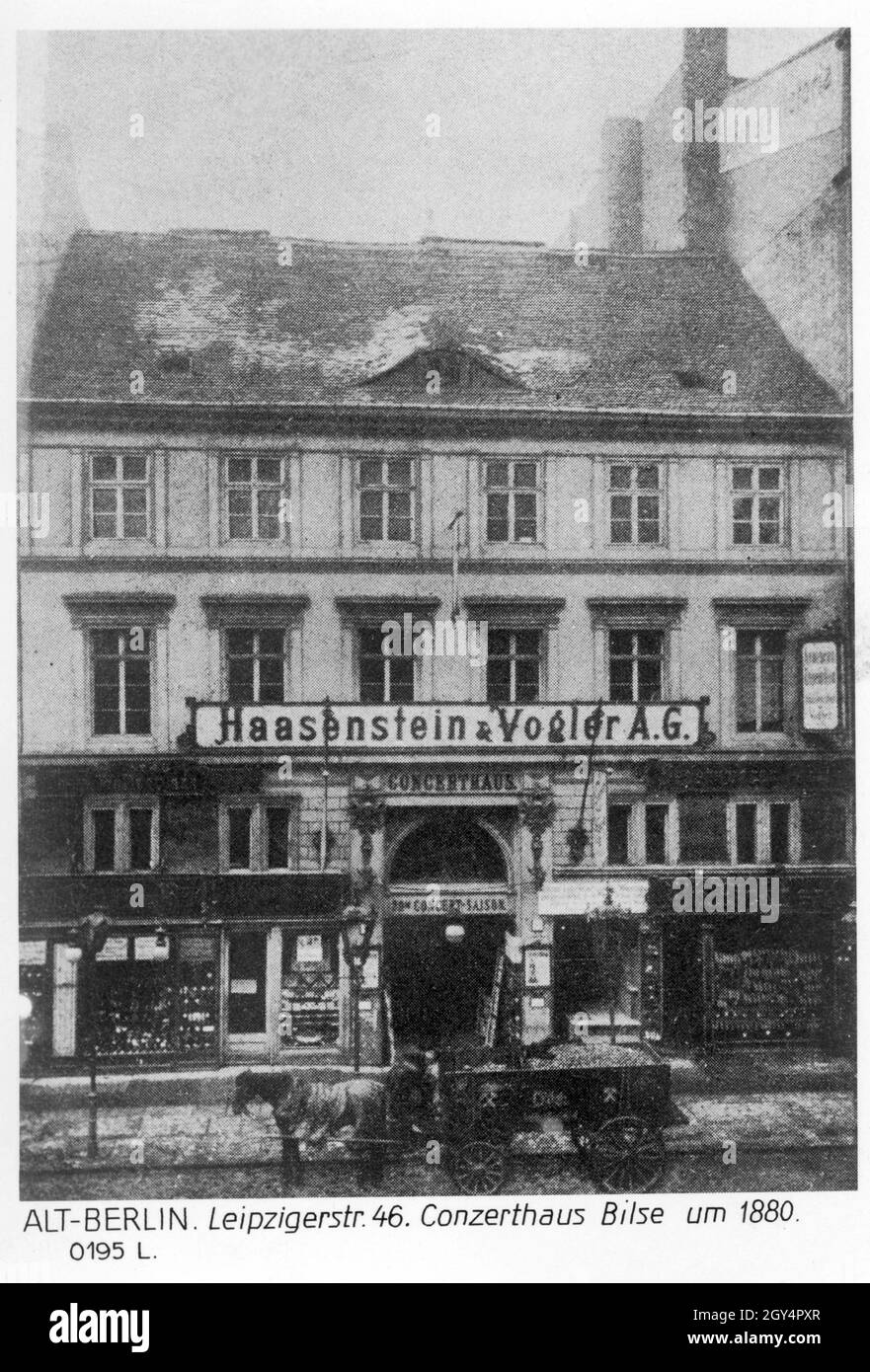 'The photograph shows Leipziger Straße No. 46 in Berlin-Mitte around the year 1880. The building houses the ''Concerthaus Bilse'' and the advertising agency ''Haasenstein und Vogler A.G.''. In front of the building a horse-drawn cart stops, which seems to have loaded potatoes. [automated translation]' Stock Photo