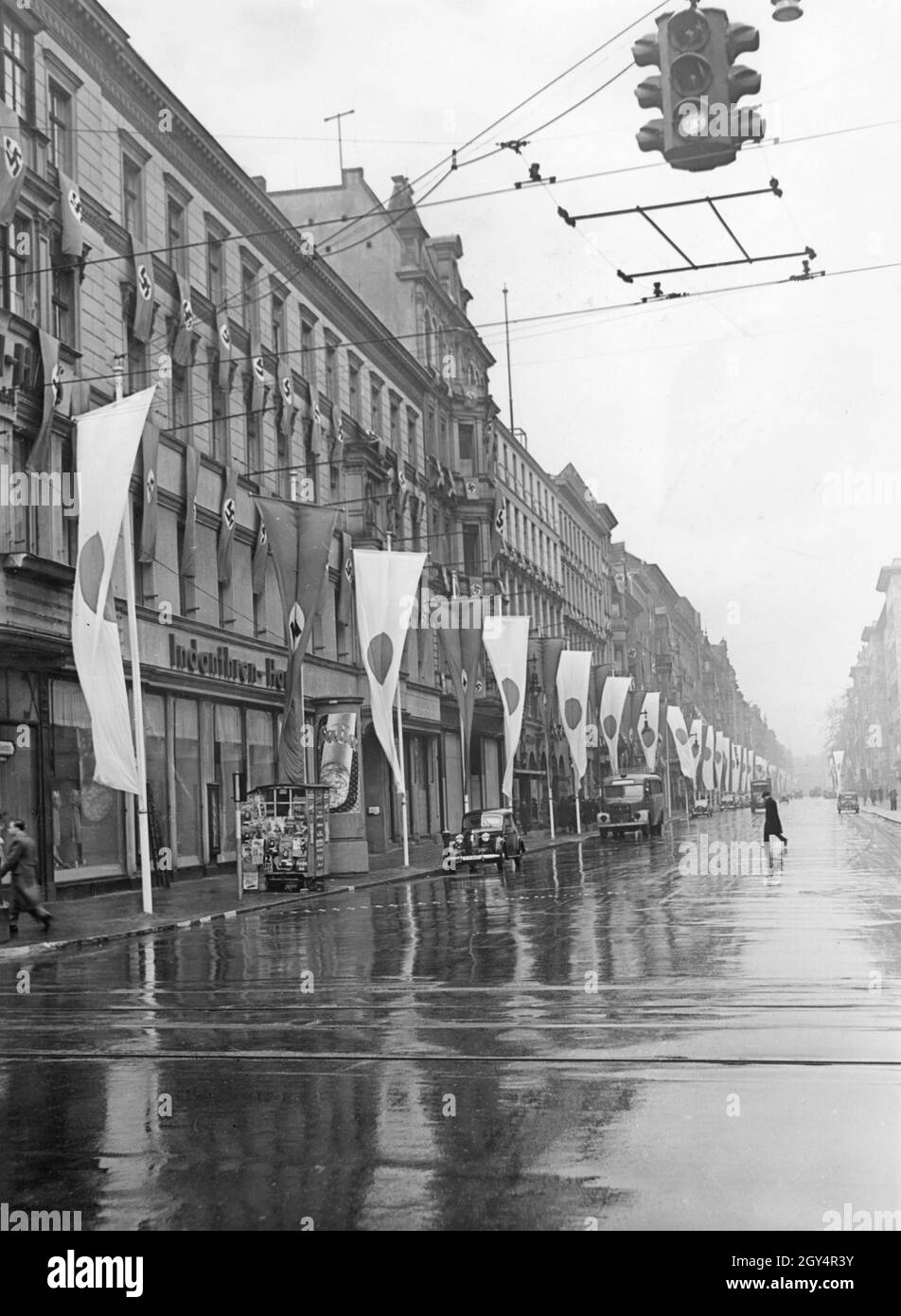 'The photograph shows the flag-draped buildings on Wilhelmstrasse in Berlin-Mitte on March 26, 1941. There is an ''Indanthren House'' on the street. The next day, Japan's Foreign Minister Matsuoka Yosuke and Adolf Hitler met in the New Reich Chancellery. [automated translation]' Stock Photo