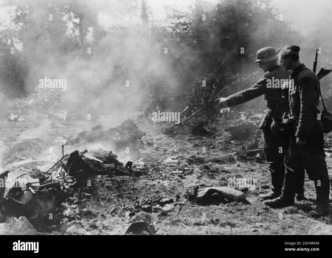 German members of the RAD secure the crash site of an American or British fighter bomber. [automated translation] Stock Photo