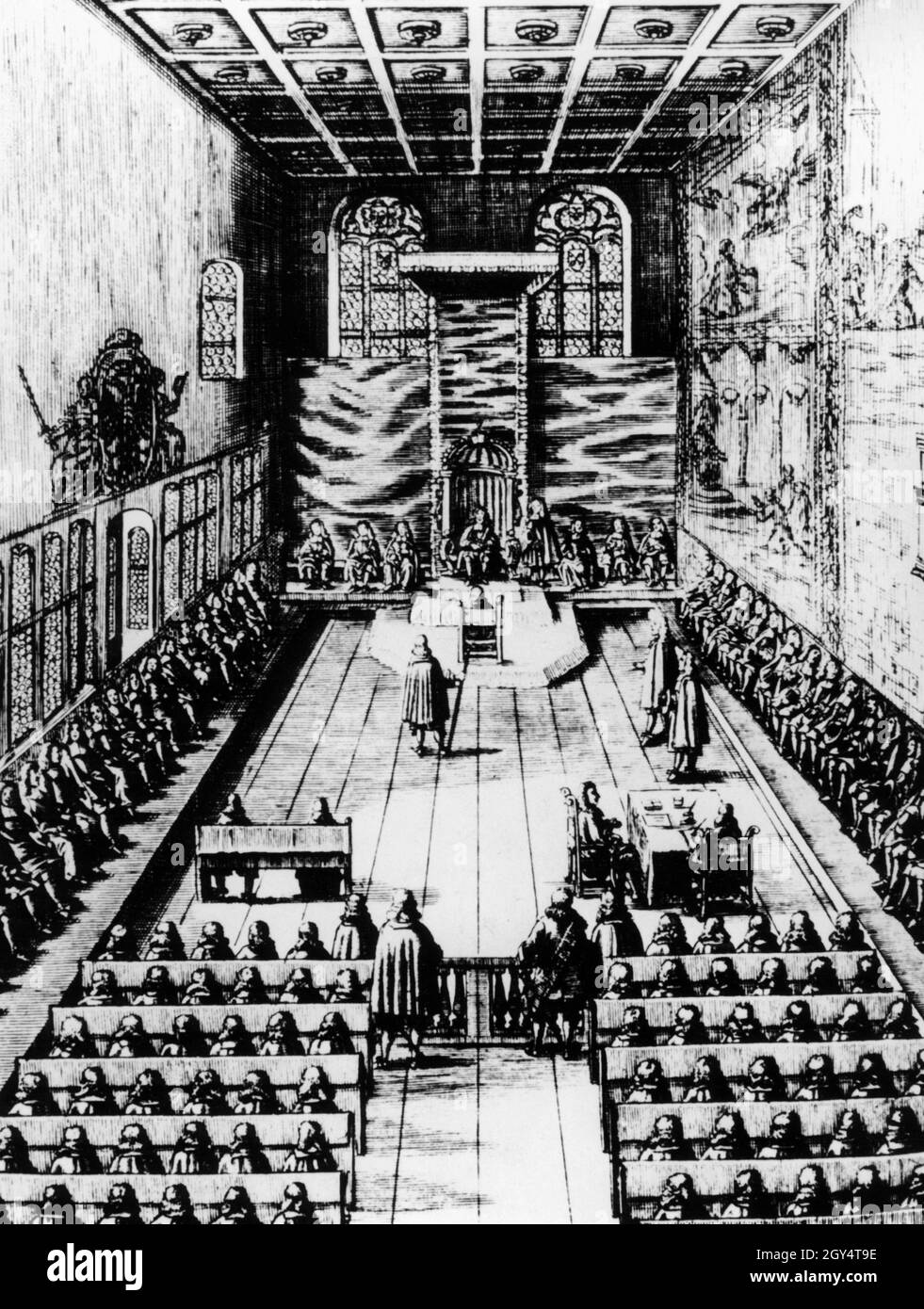 This copperplate engraving by Peter Troschel from 1675 shows a session of the Perpetual Diet in the Imperial Hall of the Old Town Hall in Regensburg. The Emperor sat on the throne, behind him the Electors, on the left the secular princes, on the right the clergy and in the foreground representatives of the imperial cities. [automated translation] Stock Photo