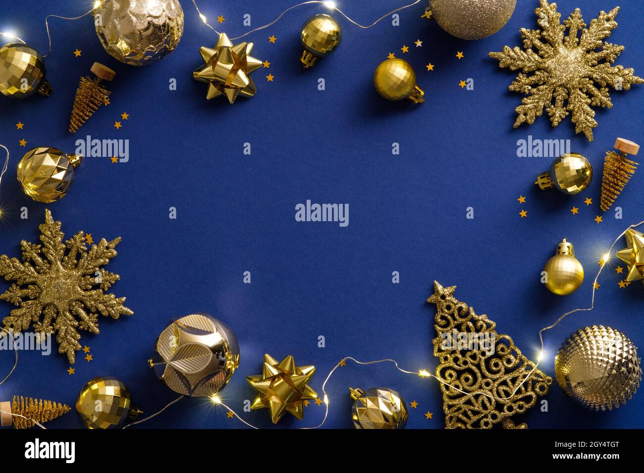 Dark blue Christmas background with golden decorations, balls