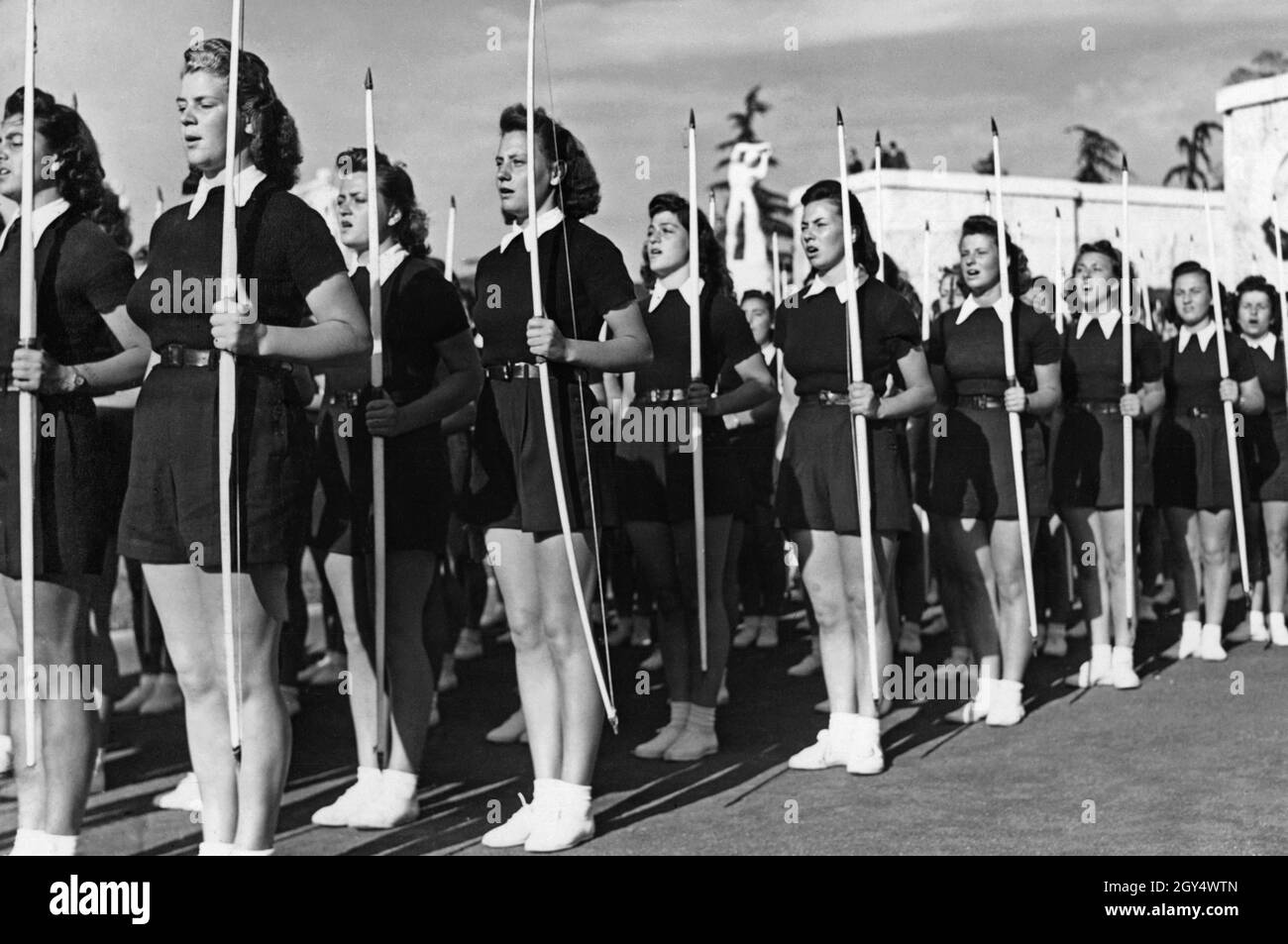 On May 23, 1940, young women of the Gioventu Italiana del Littorio, Italy's fascist youth organization, gathered in Rome at Foro Mussolini (now Foro Italico). They have lined up in front of the audience in the Marble Stadium. The occasion is the visit of a Japanese delegation in Rome. [automated translation] Stock Photo