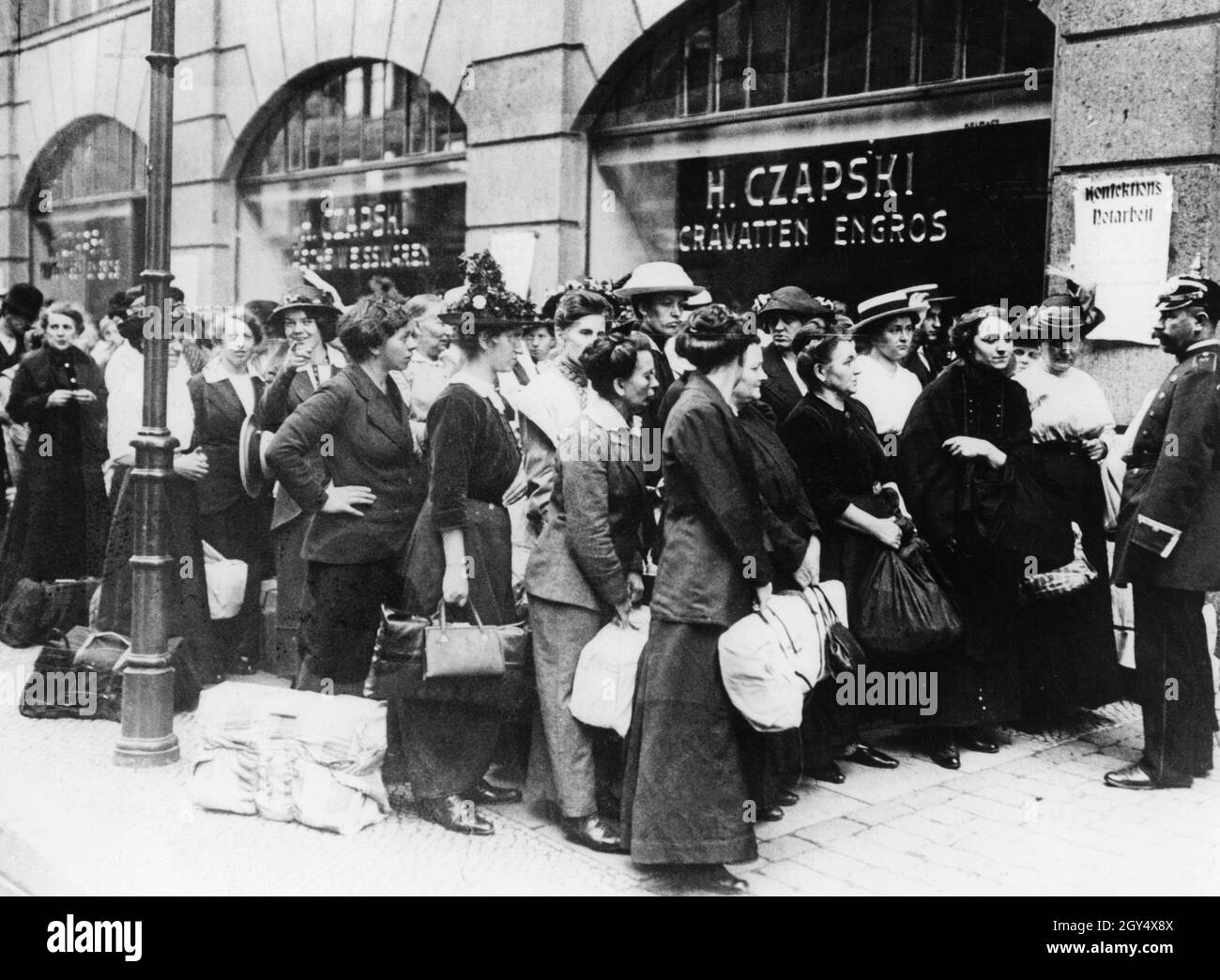 A Group Of Women Wait Outside A Clothing Factory In Berlin In The First