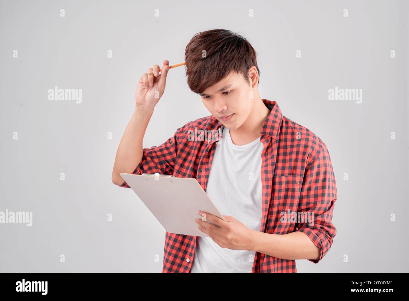 Young guy thinking something hi-res stock photography and images - Alamy