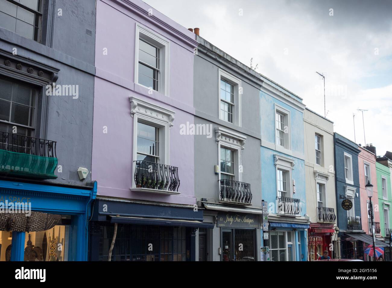 Colourful pastel shades on terraced houses on Portobello Road, Royal