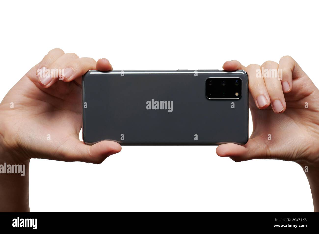 Grey smartphone in two hands back view with  triple camera isolated Stock Photo