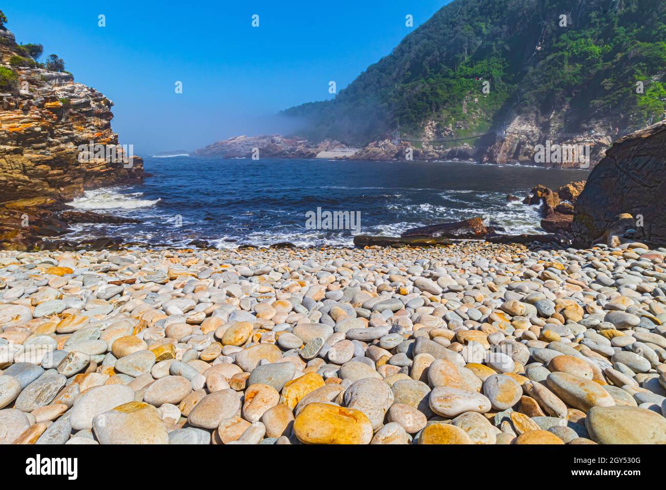 Rocky beach at Storms River Mouth in Tsitsikamma National Park of the Garden Route in Western Cape, South Africa. Stock Photo