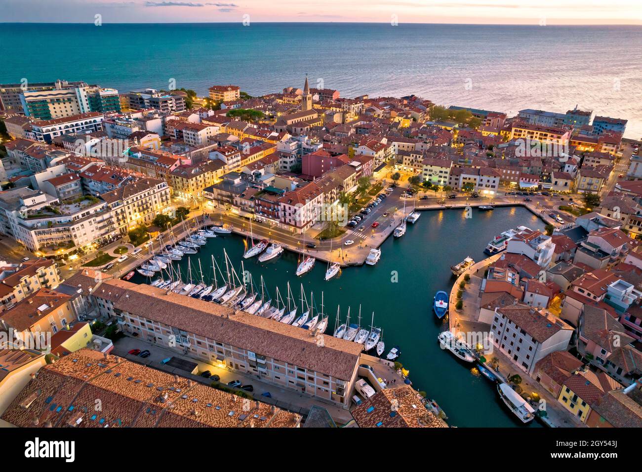 Town of Grado colorful architecture and waterfront aerial evening view, Friuli-Venezia Giulia region of Italy Stock Photo