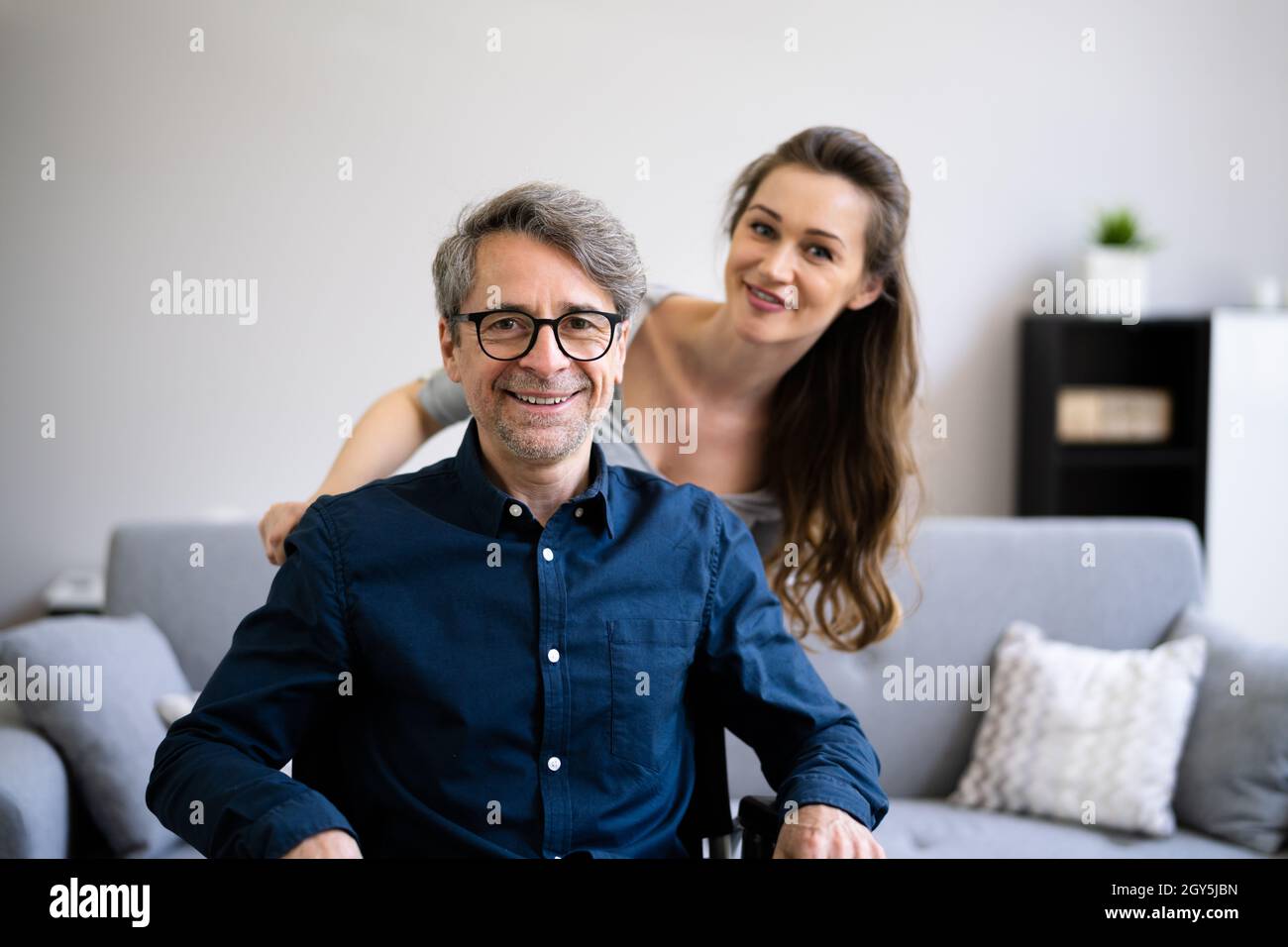 Smiling Older Man Care By Medical Nurse Stock Photo