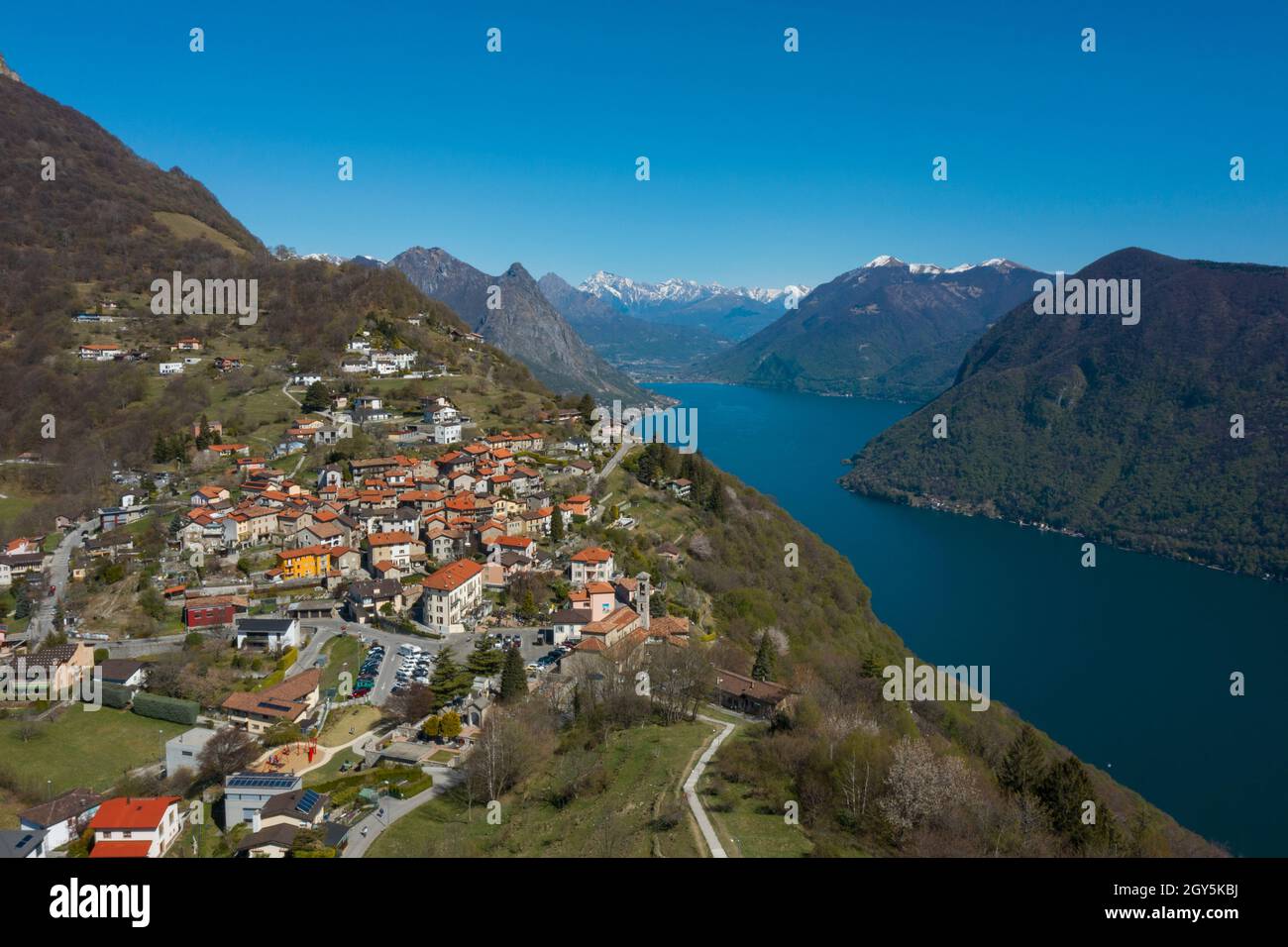 Aerial view of Lugano lake and the Monte Brè village in Canton Ticino in southern Switzerland. Sunny day Stock Photo