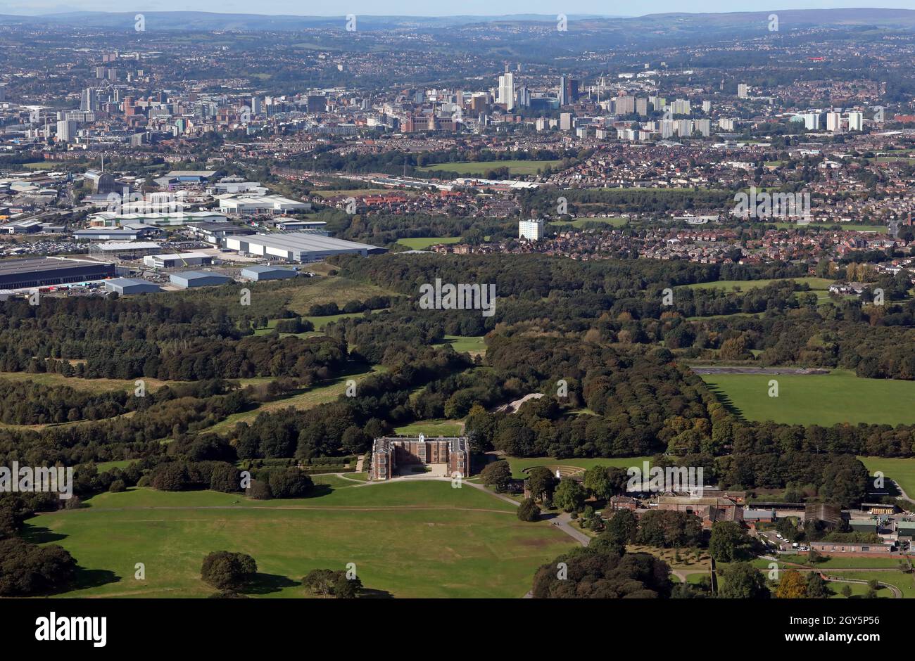 aerial view of Temple Newsam with the Leeds city centre skyline in the background Stock Photo