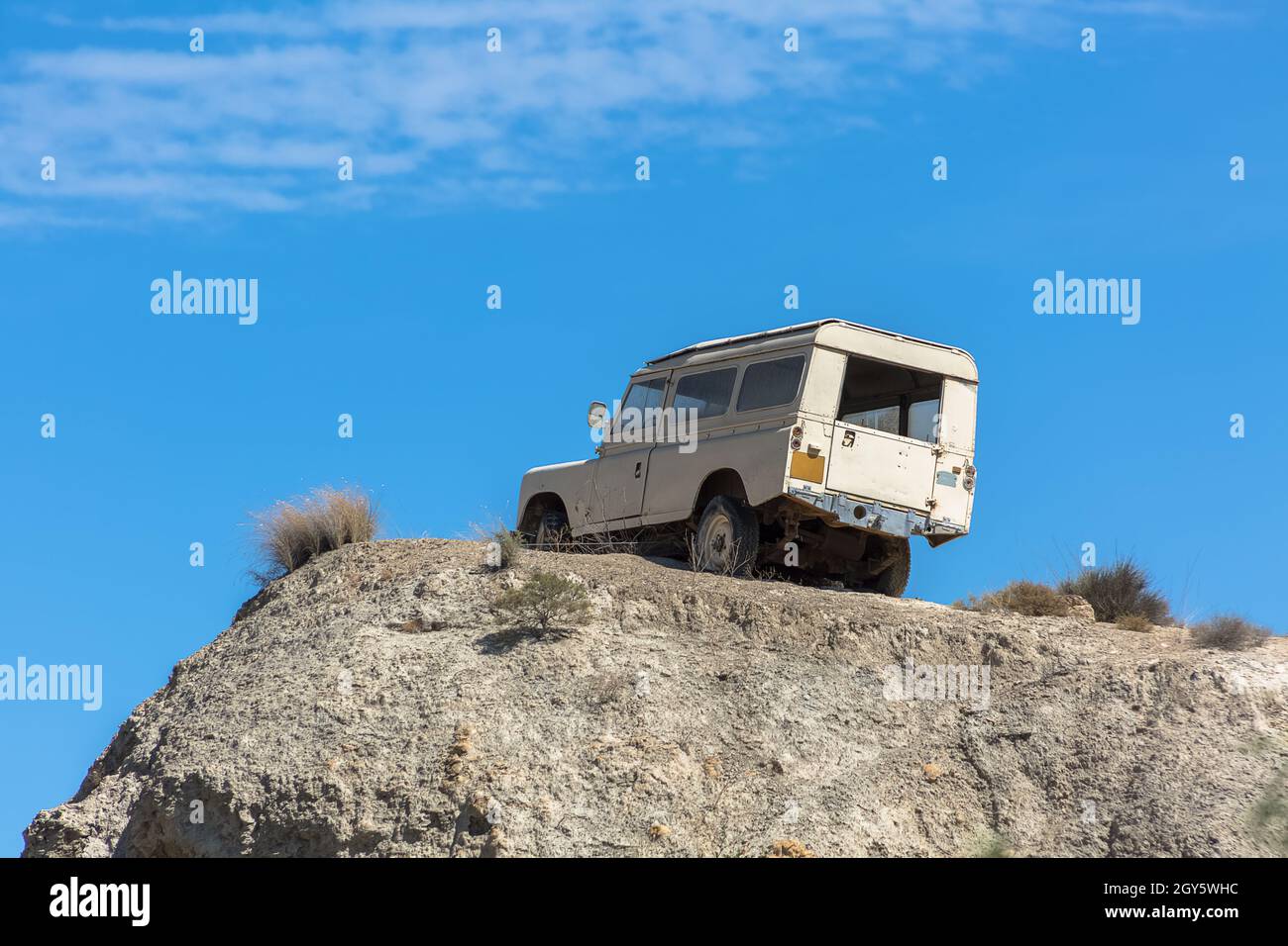 View from all terrain vehicle on top of mountain in dry desert terrain... Stock Photo