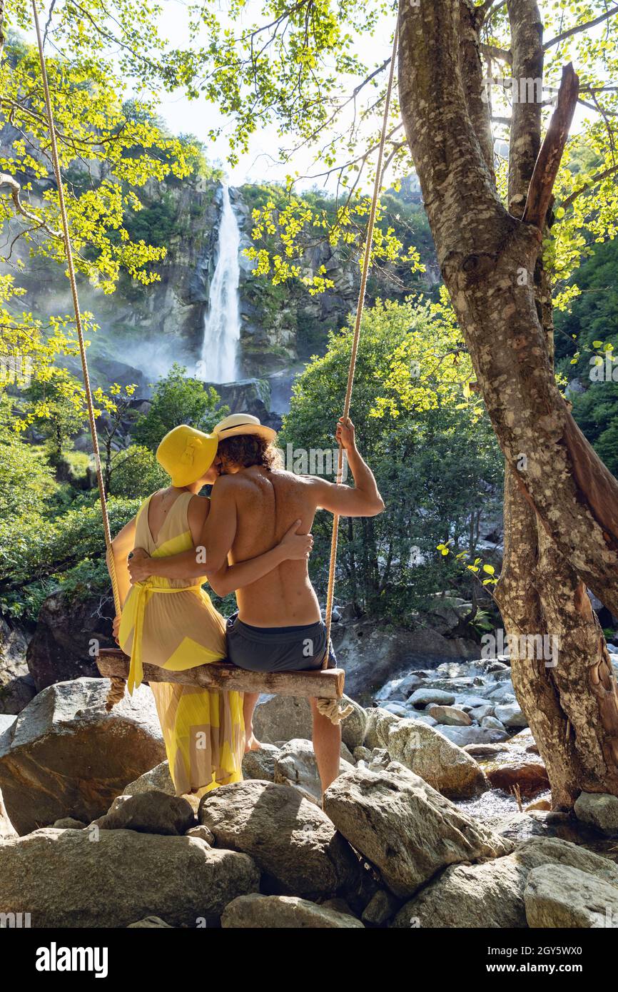 Couple in romantic swing in hi-res stock photography and images