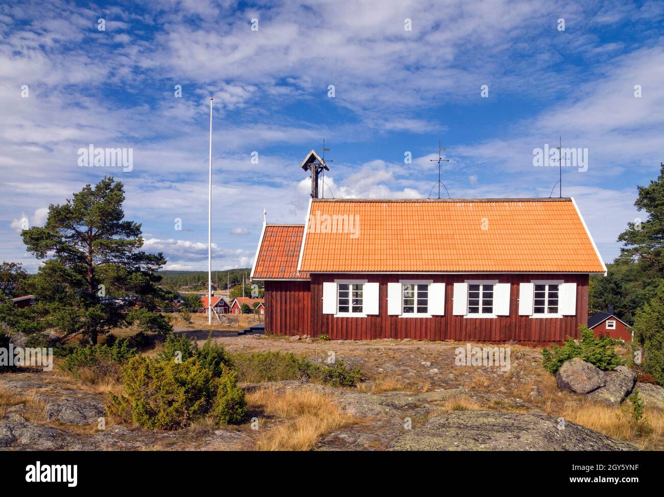 Beautiful traditional red wooden church in Holick on the Swedish Hornslandet peninsula at the Baltic sea Stock Photo