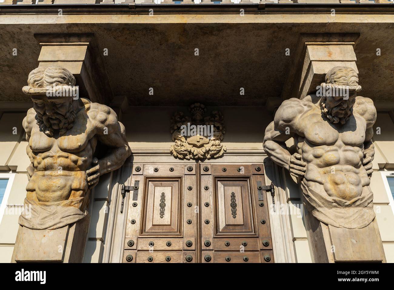 Facade with classical Greek-style sculptures of the Warsaw University or Uniwersytet Warszawski in Krakowskie Przedmiescie in the old town of Warsaw, Stock Photo