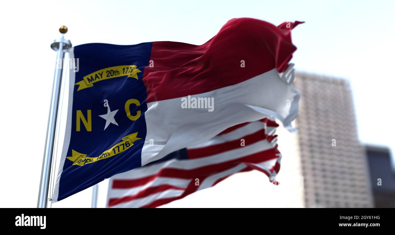 The flags of the Tennessee state and United States of America waving in the wind. Democracy and independence. American state. Stock Photo