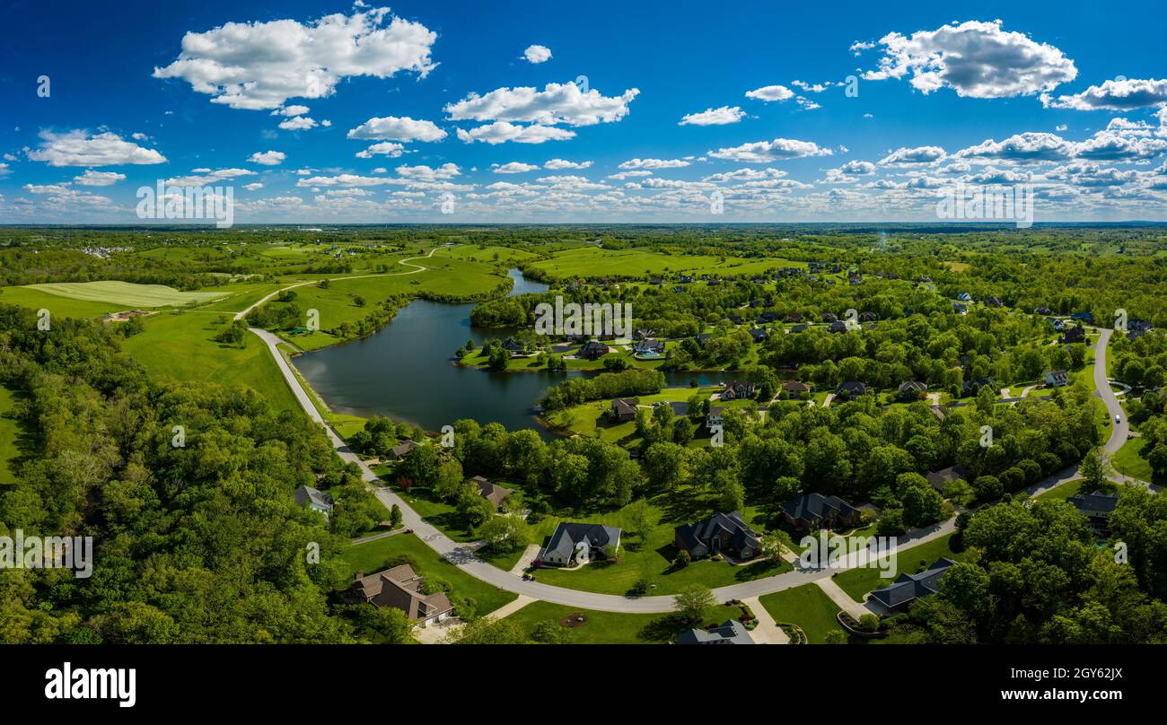 Aerial view of a residential neighborhood by a lake near
