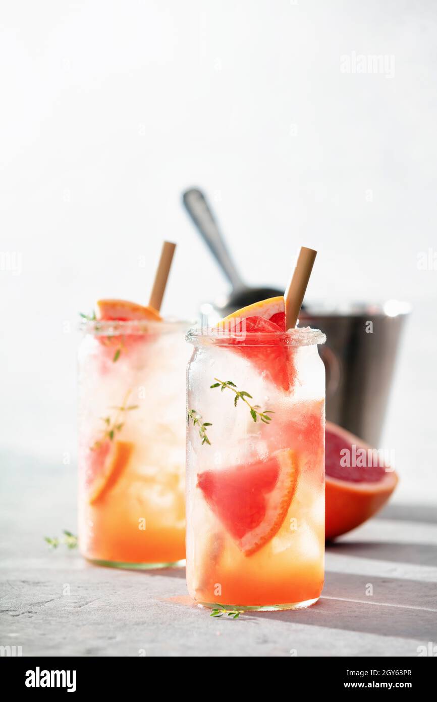 Trendy summer drinks with grapefruit and rosemary close up. Refreshing ...