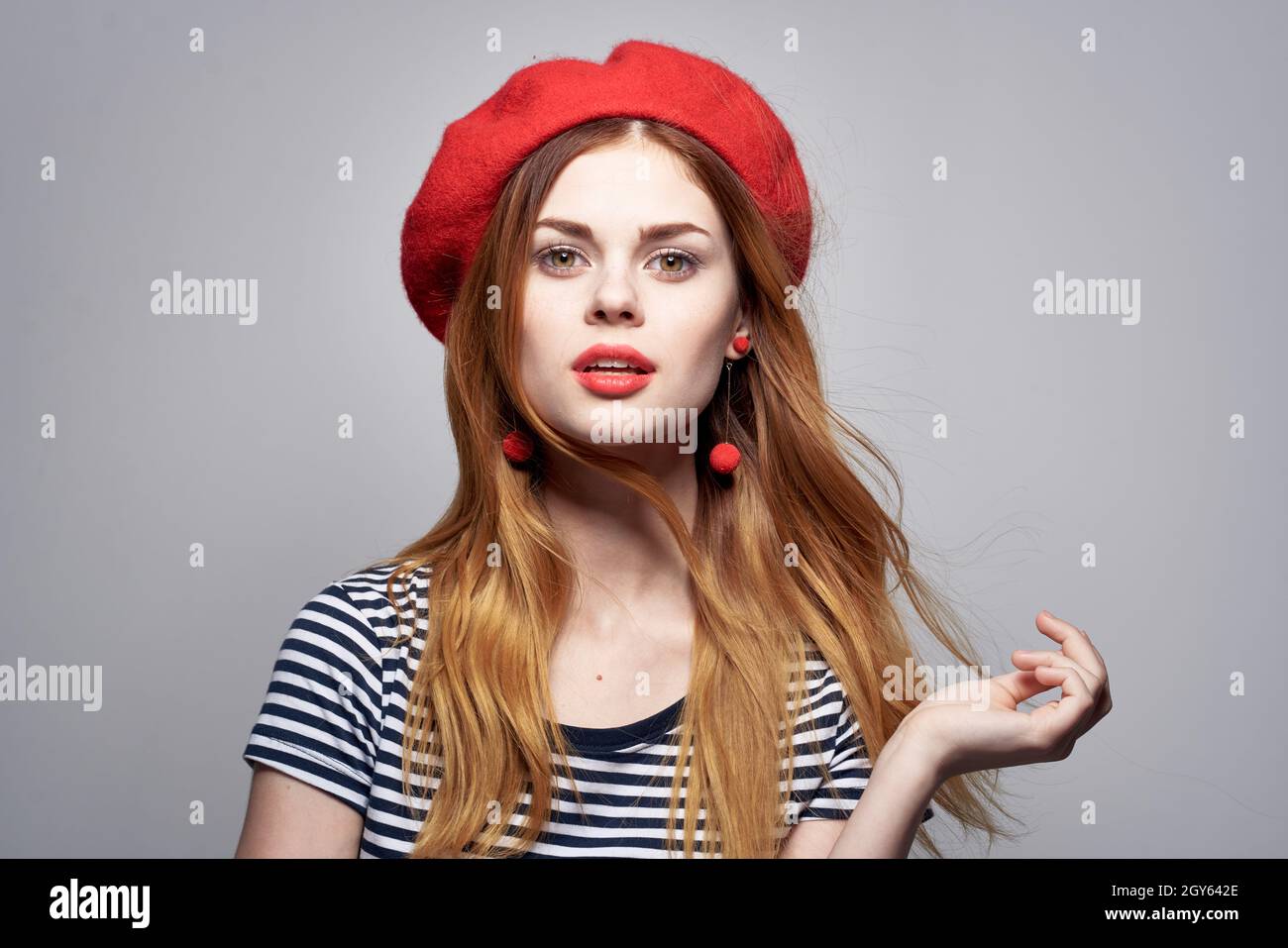 pretty woman wearing a red hat makeup France Europe fashion posing