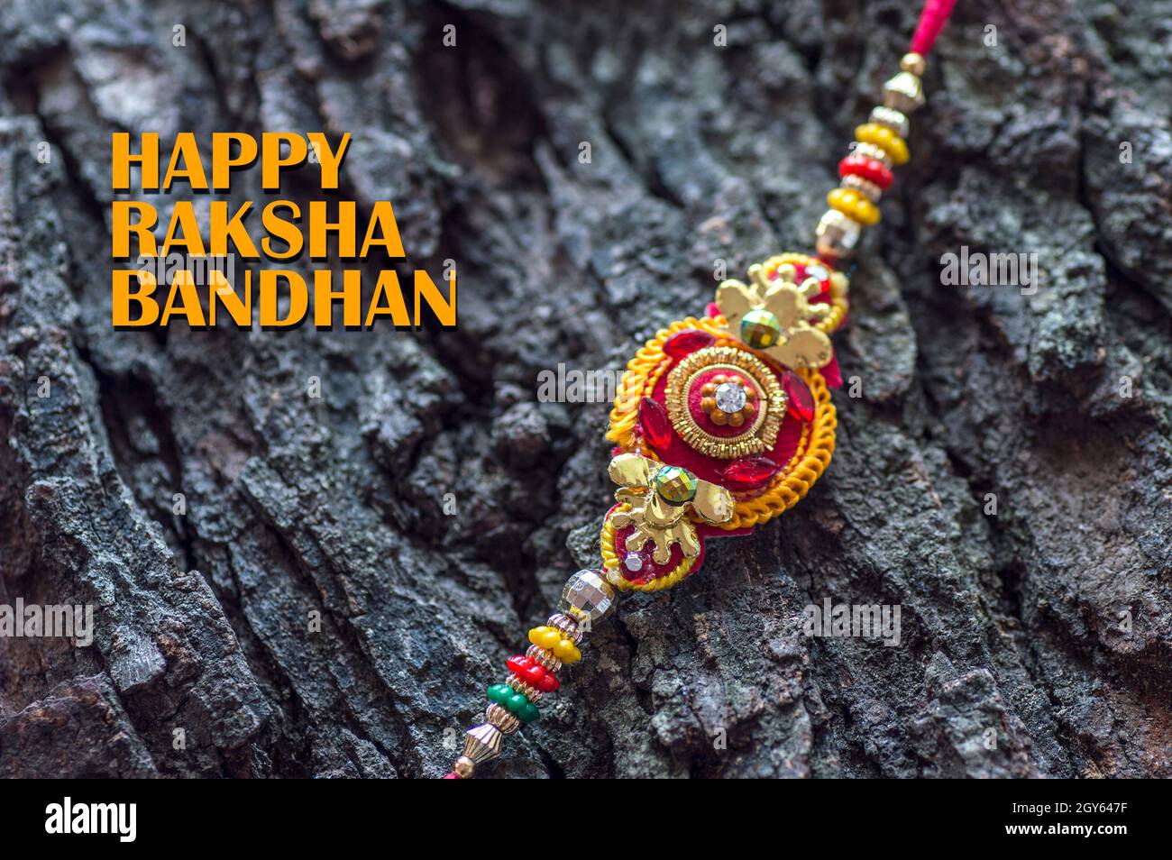Raksha Bandhan background with an elegant Rakhi. A traditional Indian ...