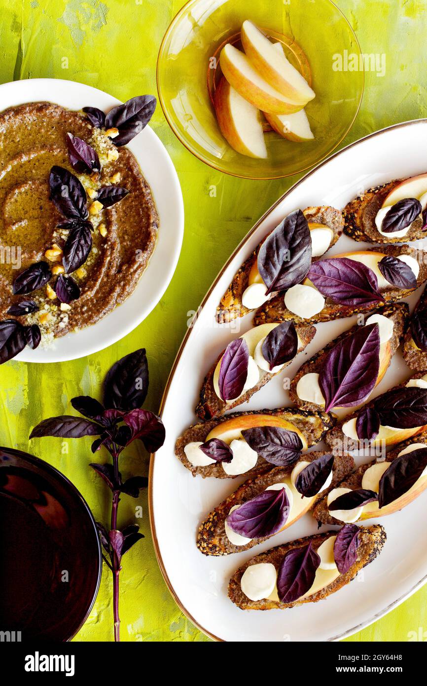 Purple Basil Pesto Crostini with Apple and Fresh Mozzarella Stock Photo
