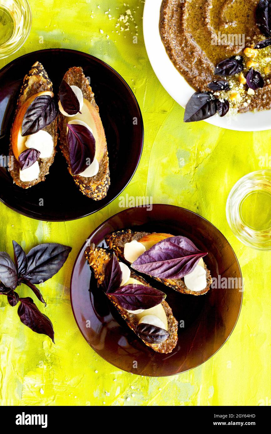 Purple Basil Pesto Crostini with Apple and Fresh Mozzarella Stock Photo