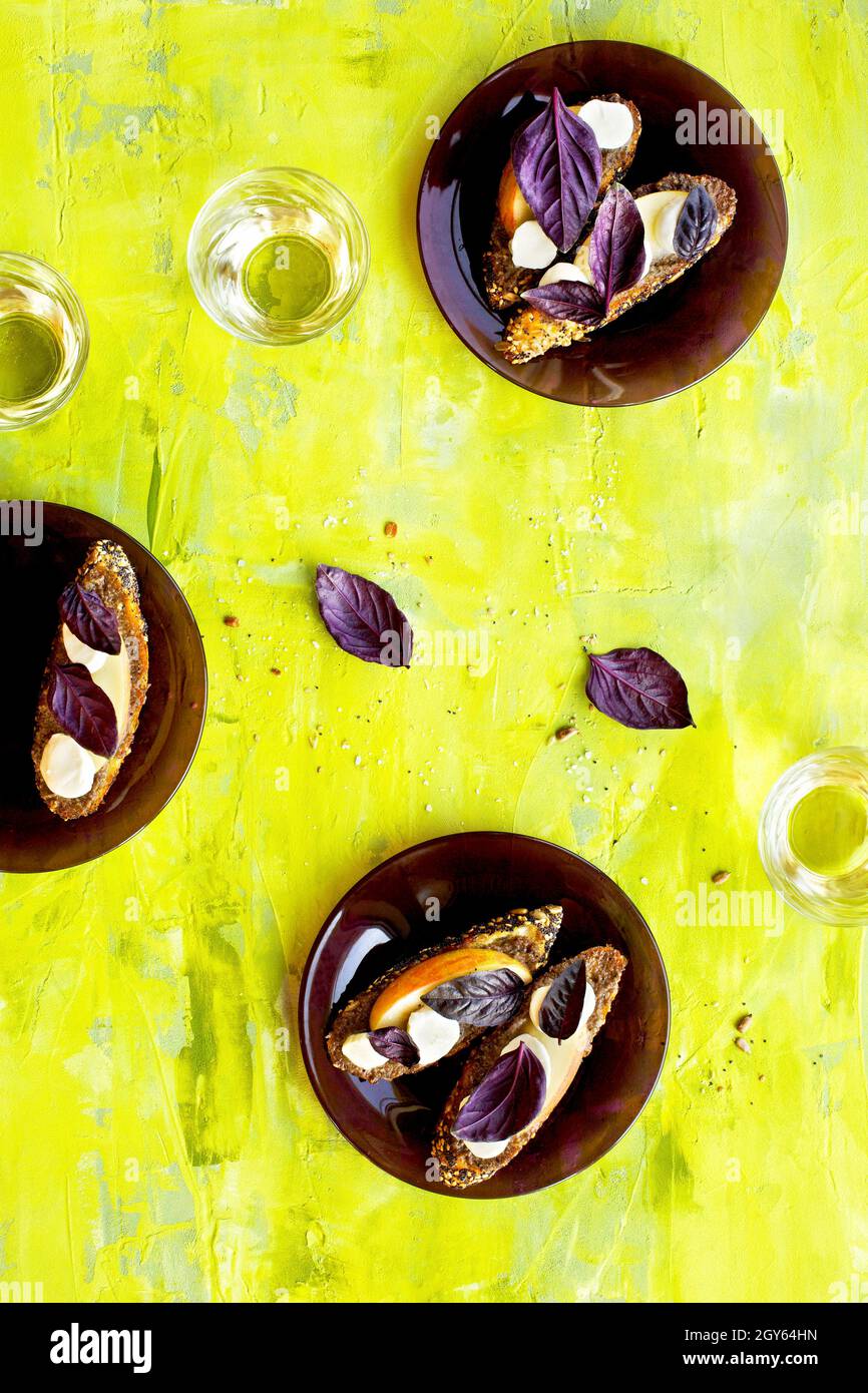 Purple Basil Pesto Crostini with Apple and Fresh Mozzarella Stock Photo