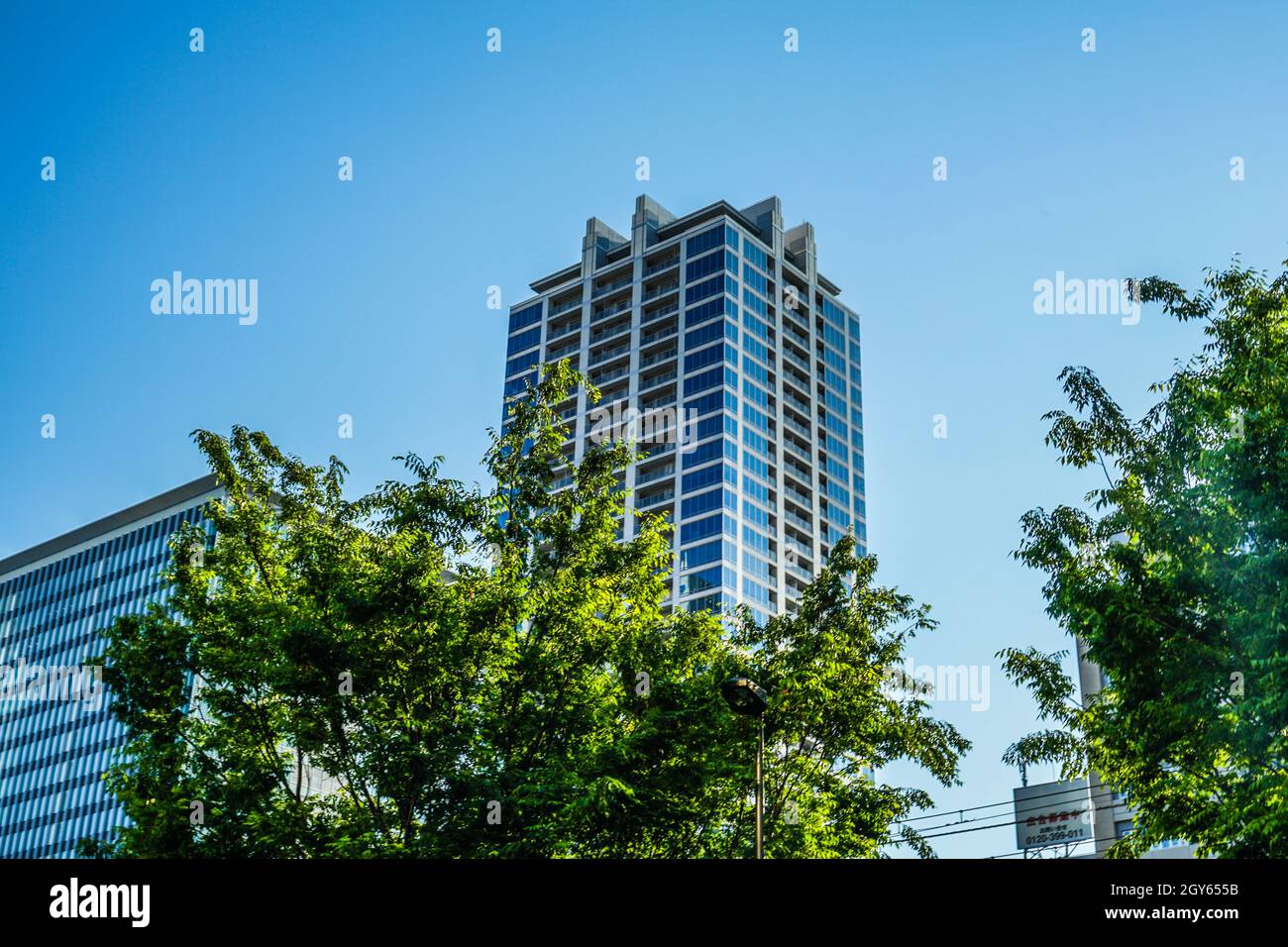 Sunny blue sky and the Akihabara of buildings. Shooting Location: Tokyo metropolitan area Stock Photo